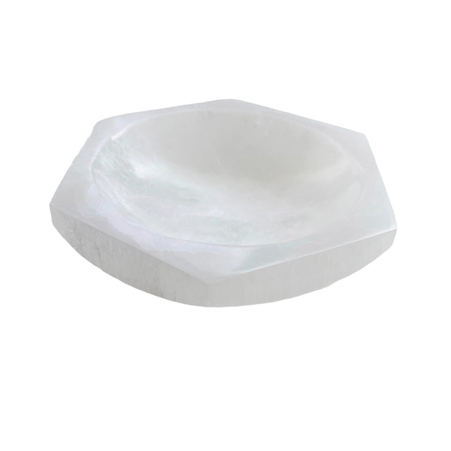 A hexagon-shaped Selenite Charging Bowl, showcasing its translucent and smooth surface, ideal for cleansing gemstones.