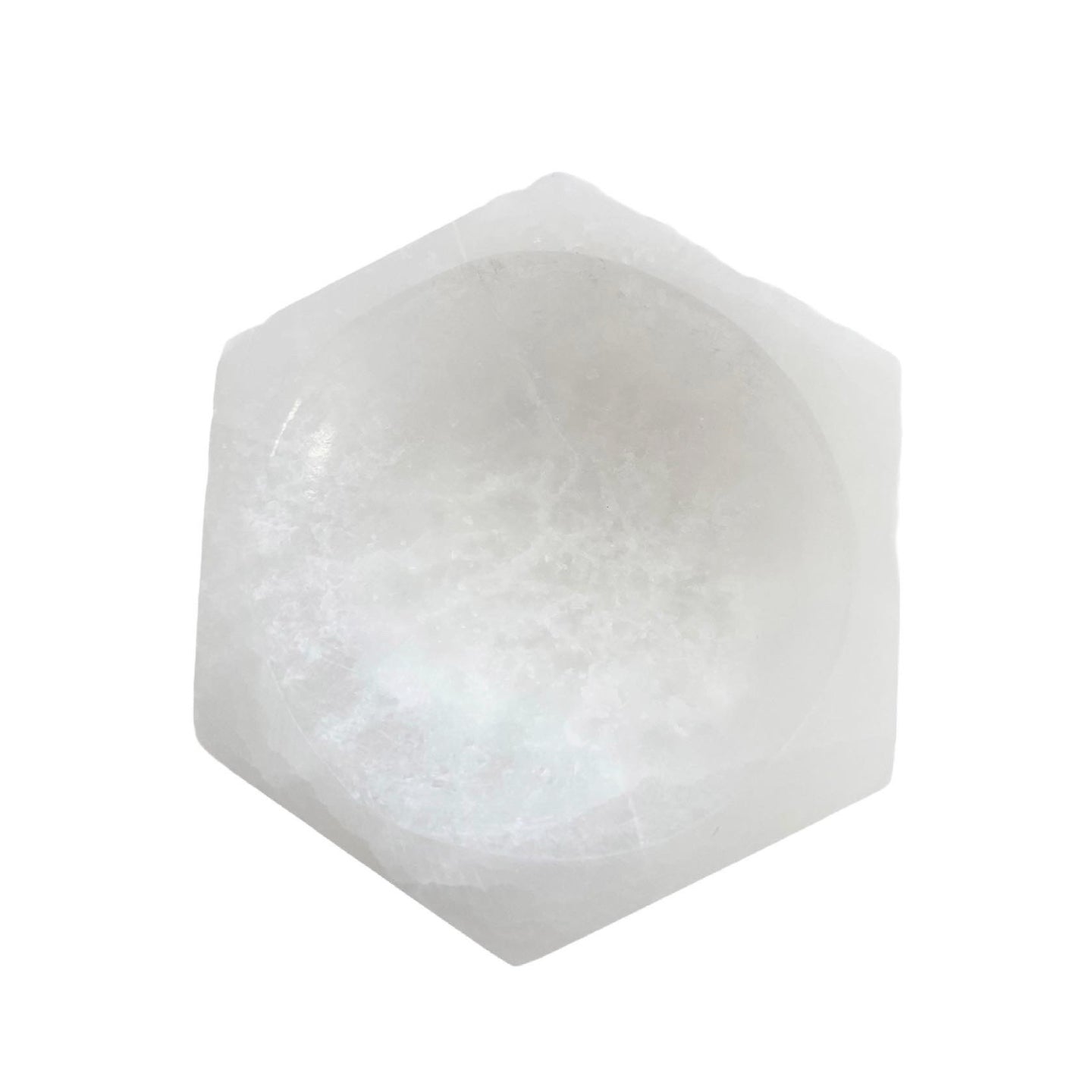 A hexagon-shaped Selenite Charging Bowl, showcasing its translucent and smooth surface, ideal for cleansing gemstones.