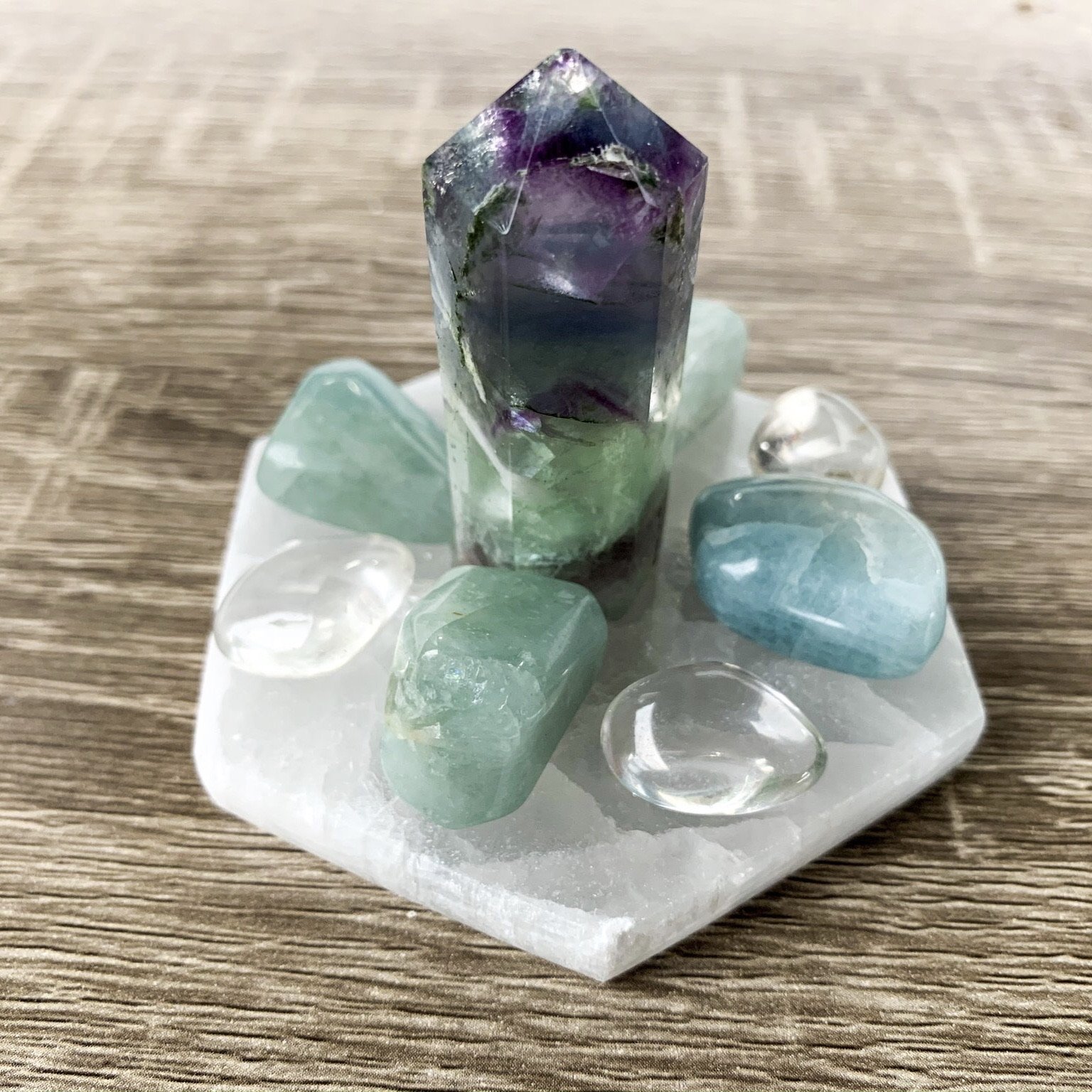 Hexagon-shaped Selenite Charging Table for cleansing and recharging gemstones, featuring a smooth, translucent surface.