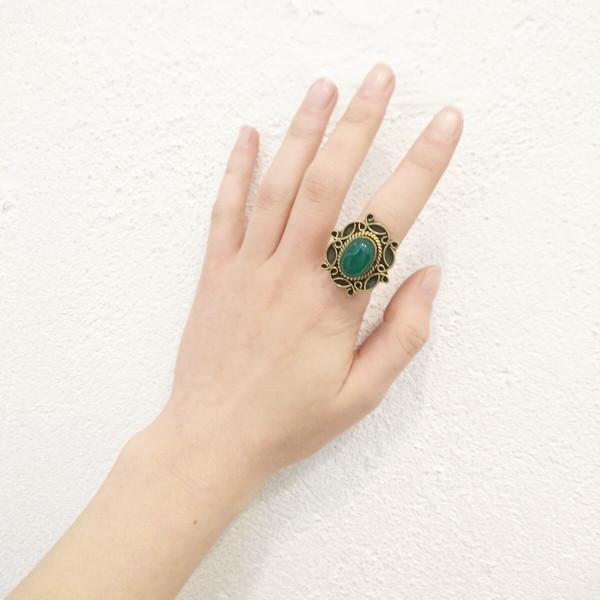 A detailed image of the Sensual Stone Ring featuring a semi-precious stone set in an intricate brass design, showcasing its elegance and craftsmanship.