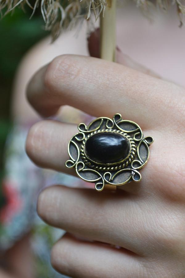 A detailed image of the Sensual Stone Ring featuring a semi-precious stone set in an intricate brass design, showcasing its elegance and craftsmanship.