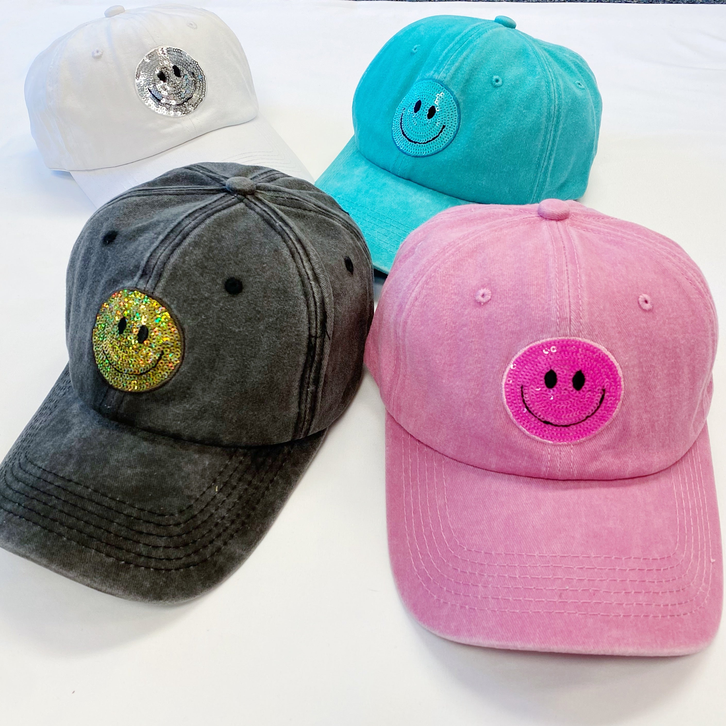 A stylish Sequin Patch Happy Ball Cap featuring a cheerful sequin happy face patch on a washed finish fabric, perfect for casual wear.