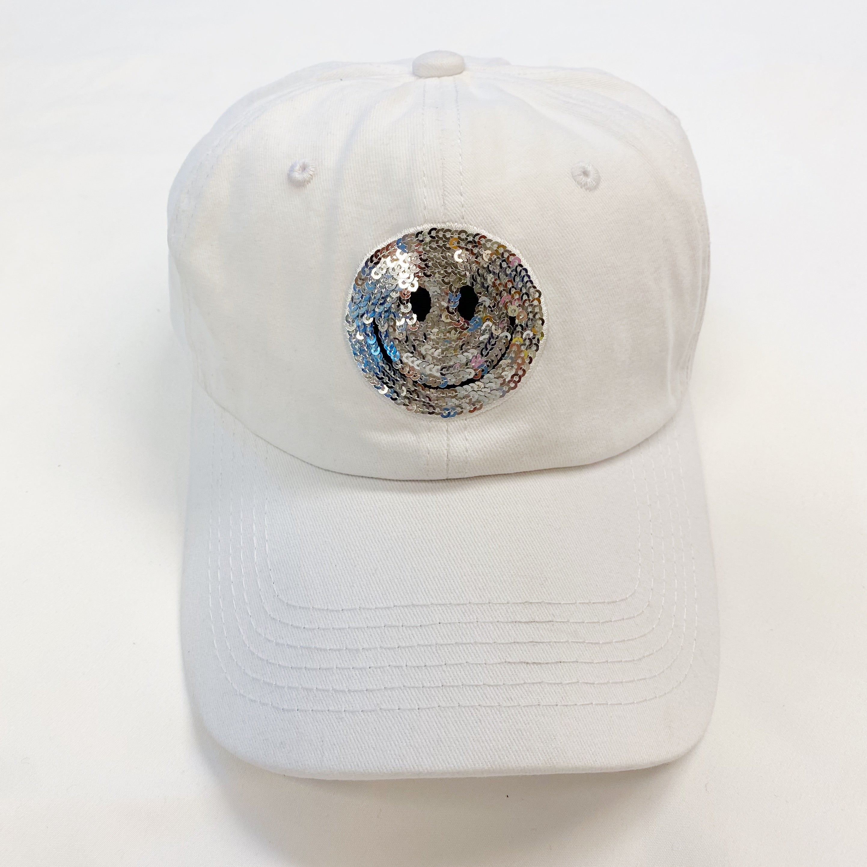 A stylish Sequin Patch Happy Ball Cap featuring a cheerful sequin happy face patch on a washed finish fabric, perfect for casual wear.