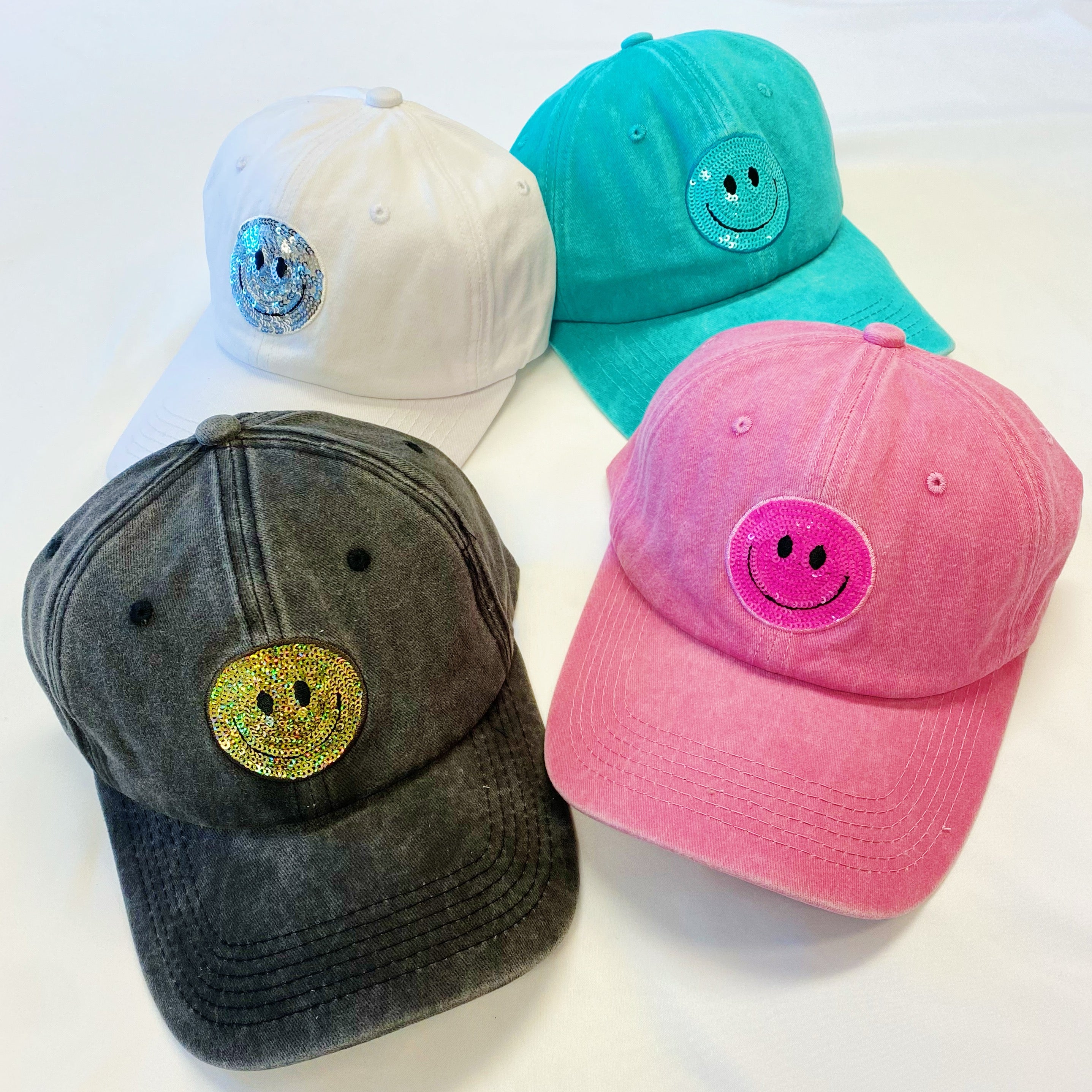 A stylish Sequin Patch Happy Ball Cap featuring a cheerful sequin happy face patch on a washed finish fabric, perfect for casual wear.