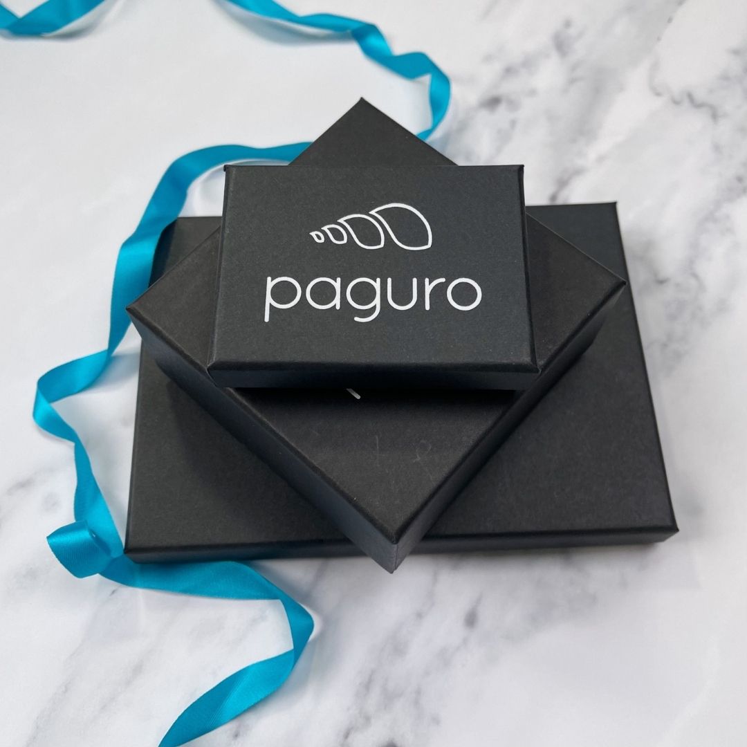 Seraphine (II) Inner Tube Necklace made from recycled rubber, featuring unique patterns and a lightweight design, elegantly displayed in a luxury gift box.