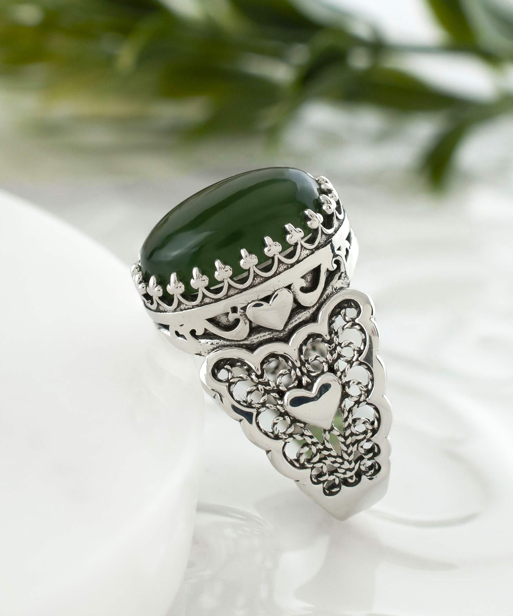 Elegant 925 sterling silver double heart filigree ring featuring a natural serpentine gemstone, beautifully crafted for a stylish look.