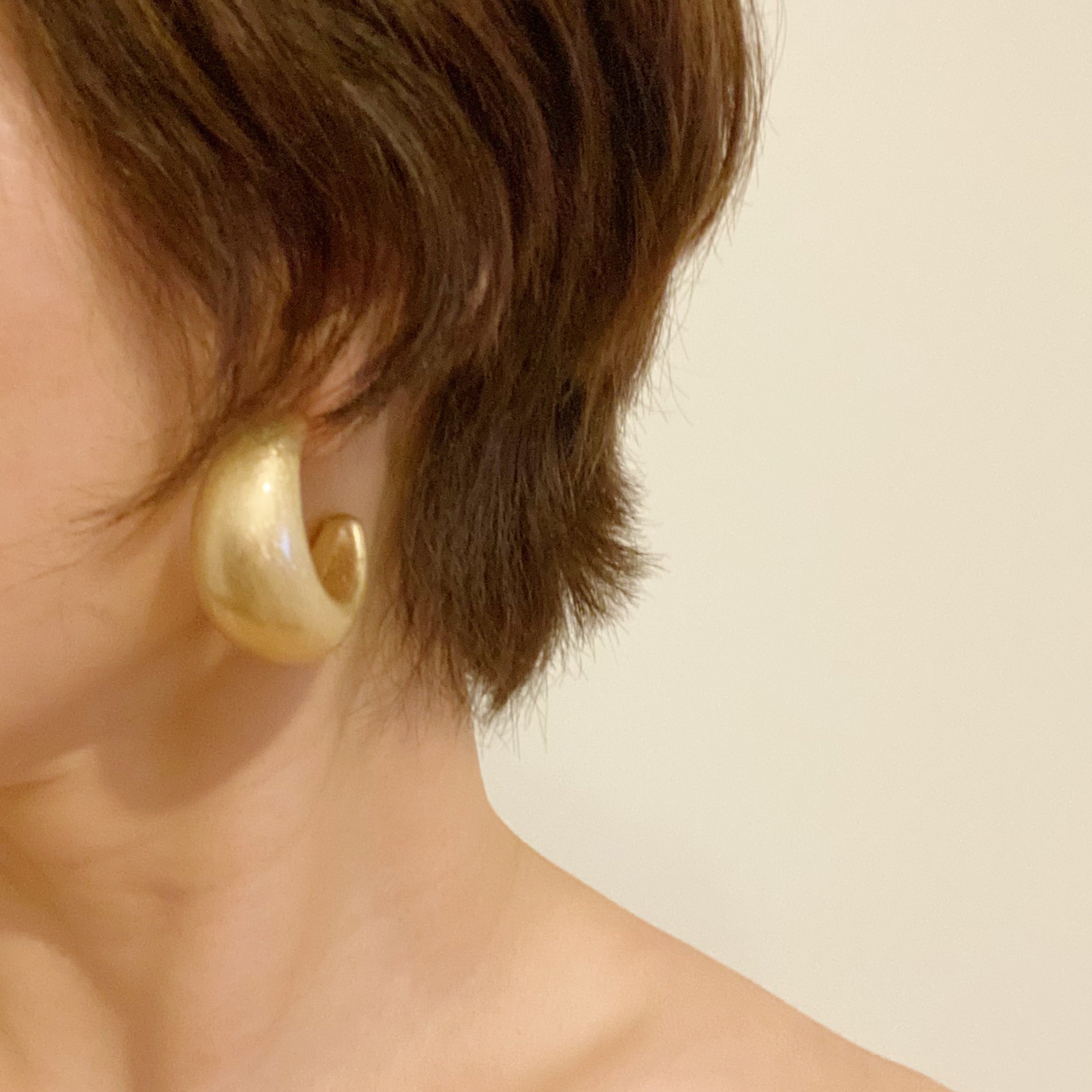 Set of 3 pairs of hoop earrings featuring small classy studs and bold larger hoops, gold plated alloy metal design.