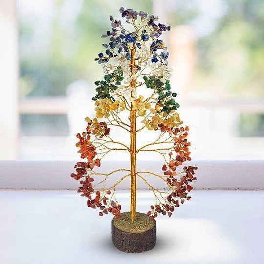 A beautifully crafted Seven Chakra Natural Gemstone Tree featuring 500 colorful gemstone chips representing the seven chakras, symbolizing good luck and prosperity.