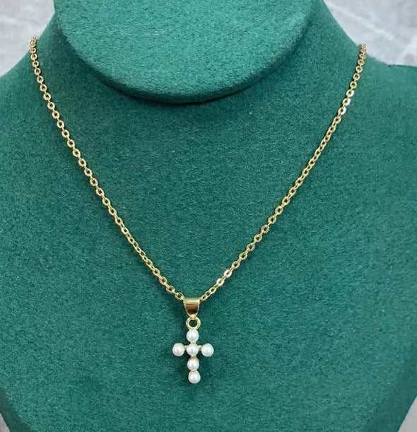 Elegant Shell Pearl Cross Necklace featuring a chic cross pendant on a stainless steel chain.