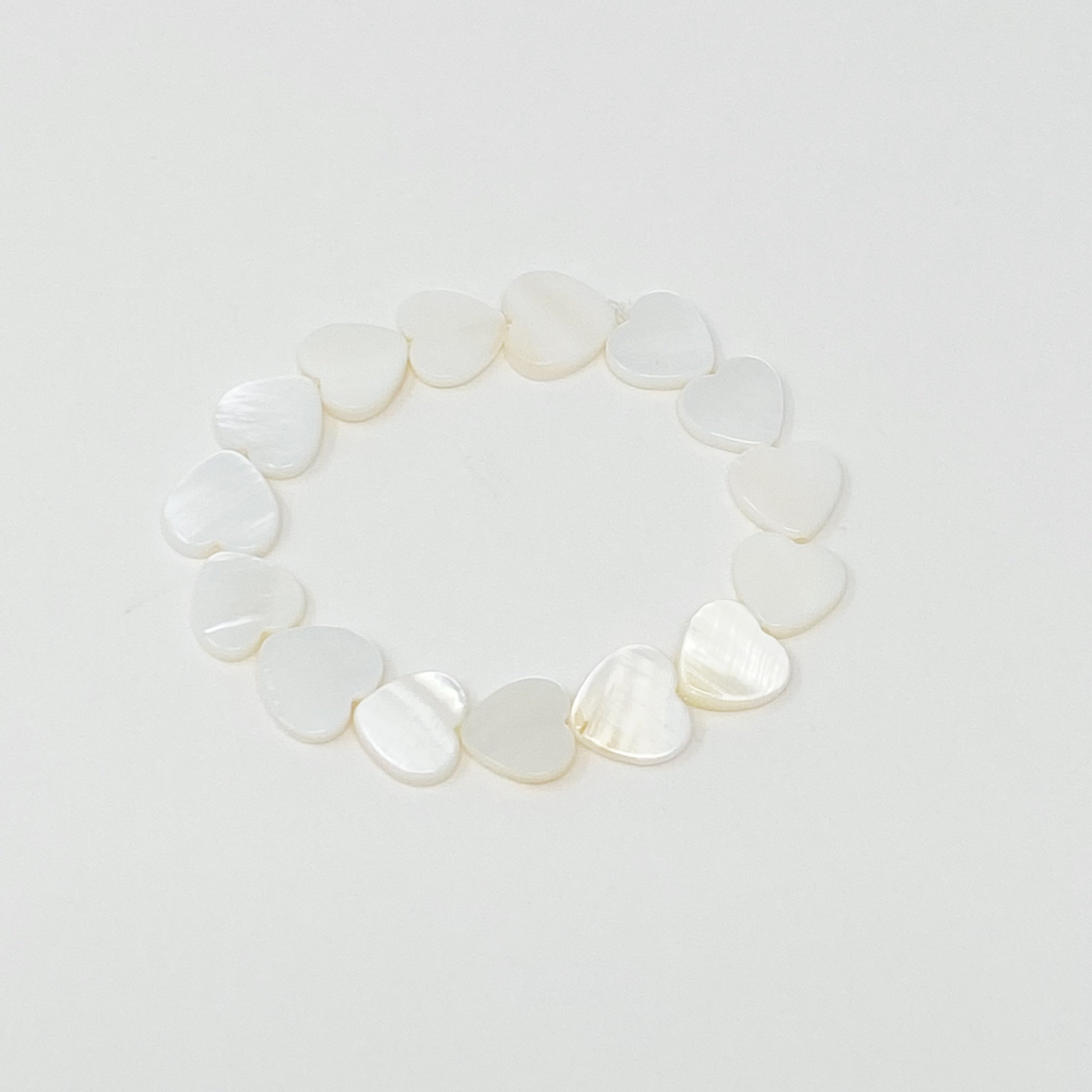 Colorful Shelly Heart Stretch Bracelet featuring heart-shaped shell beads in various hues, designed for comfort and style.