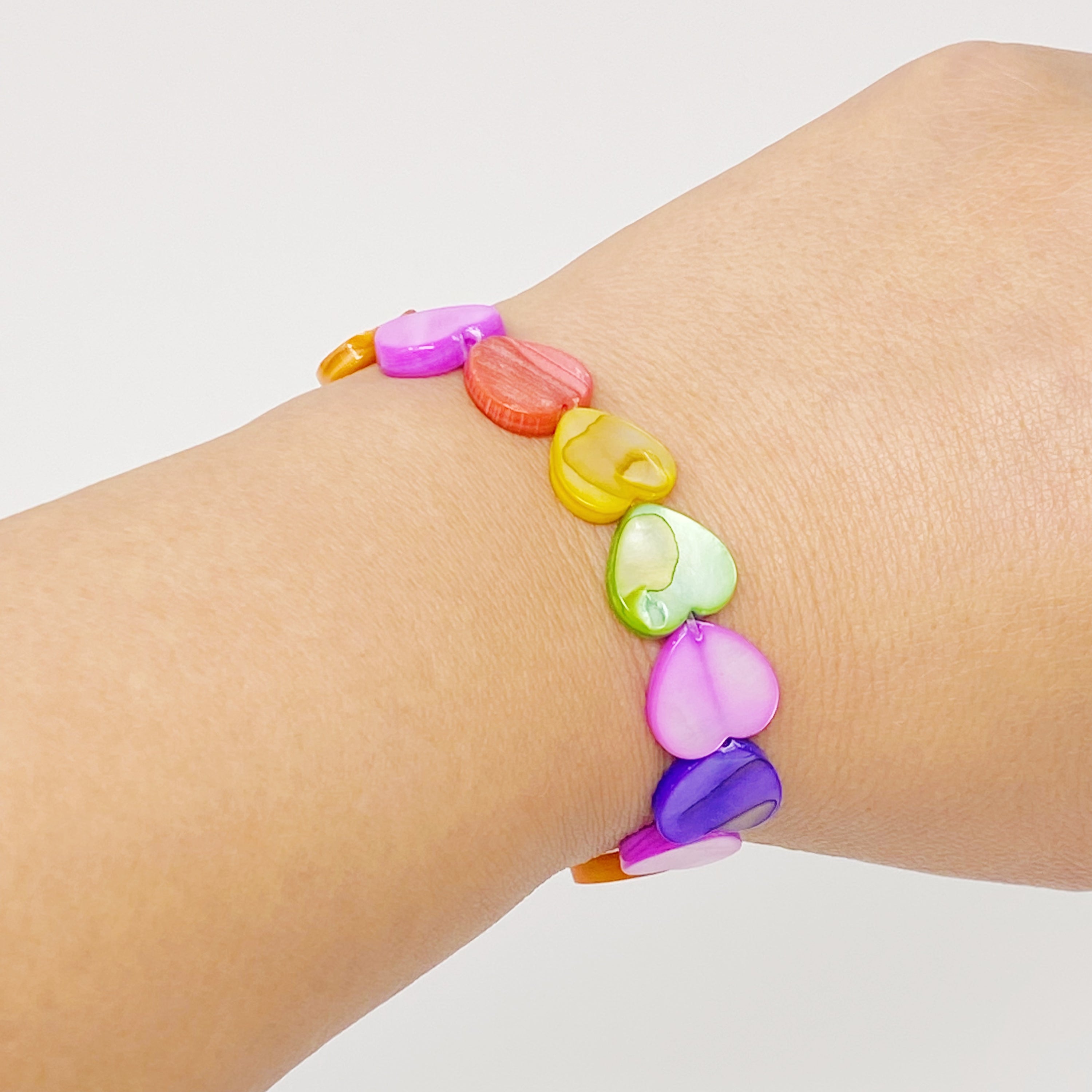 Colorful Shelly Heart Stretch Bracelet featuring heart-shaped shell beads in various hues, designed for comfort and style.