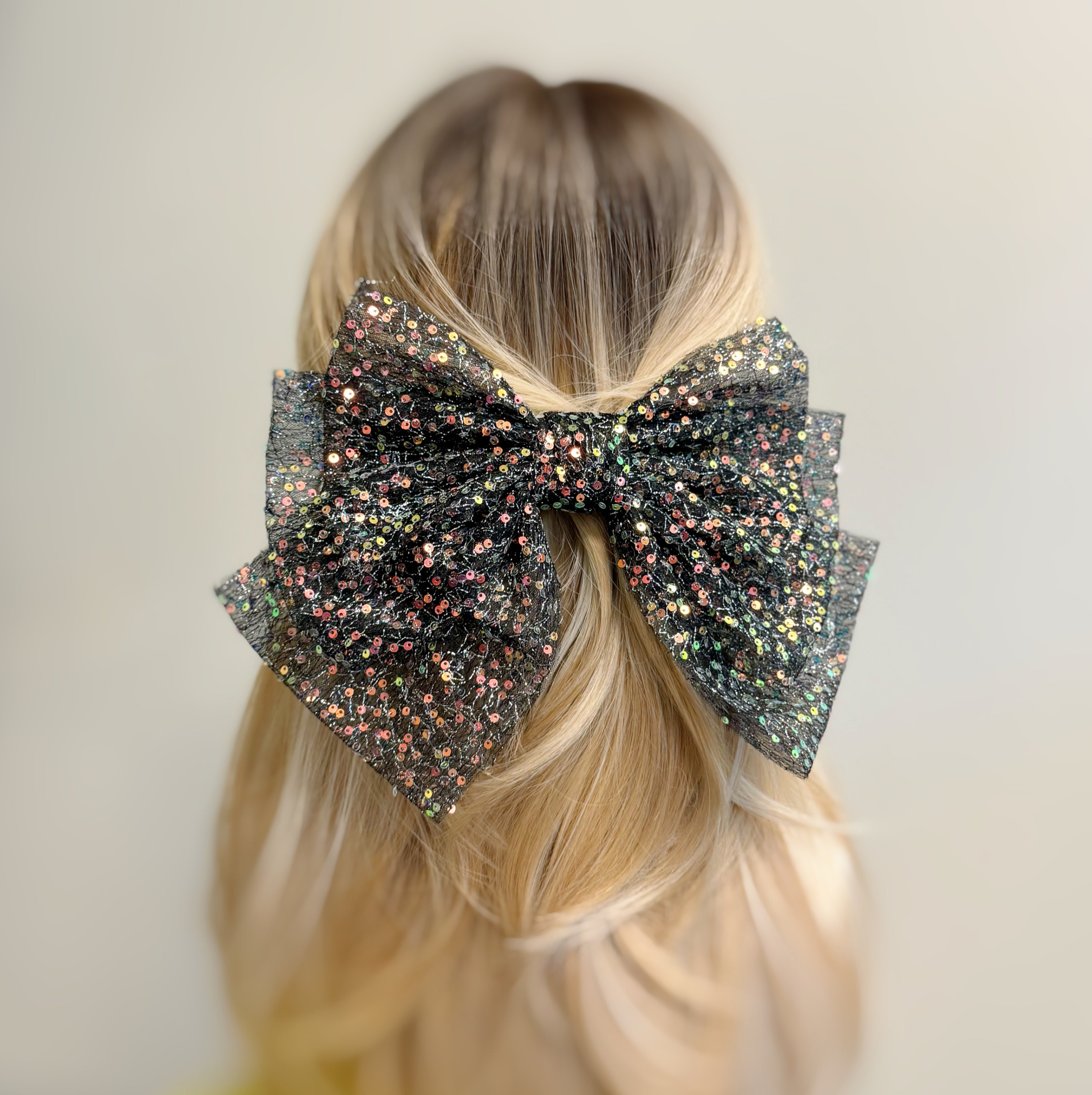 Shimmer Lover Bow Hair Clip featuring an elegant bow design with a shimmering finish, perfect for stylish hairdos.