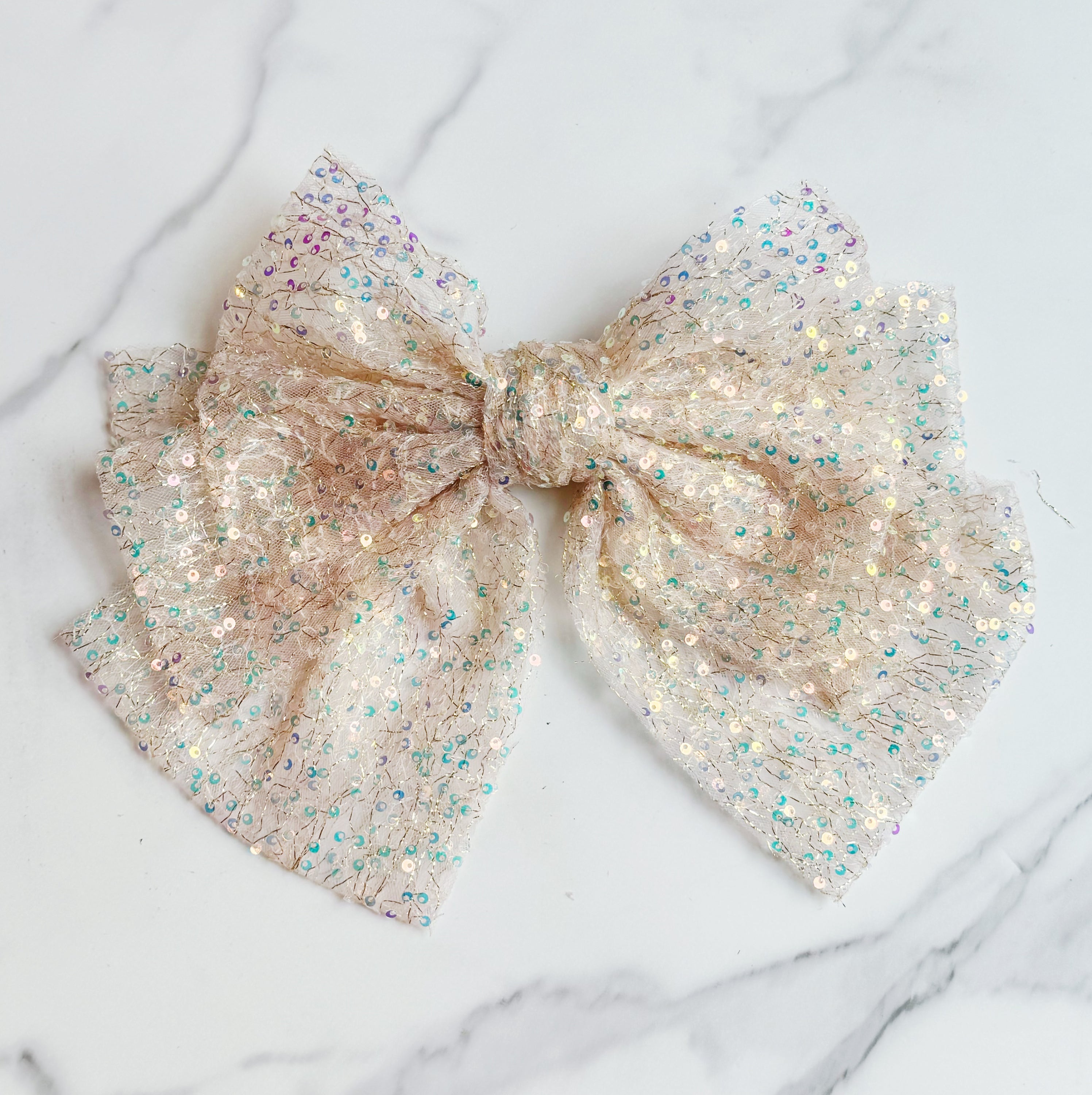 Shimmer Lover Bow Hair Clip featuring an elegant bow design with a shimmering finish, perfect for stylish hairdos.