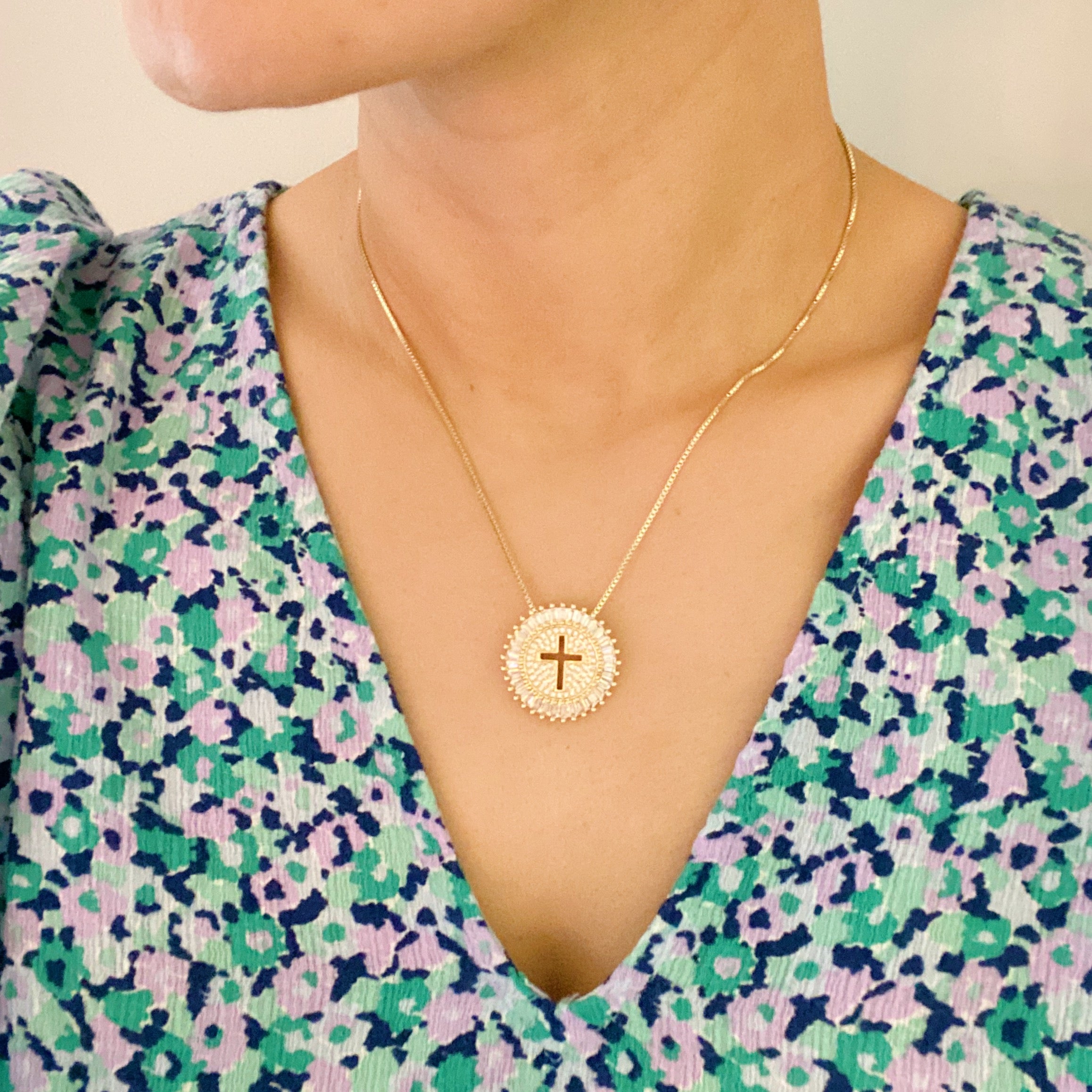 Shine Circle Cross Necklace featuring a sparkly round charm with a cut-out cross design, plated brass, and cubic zirconia.