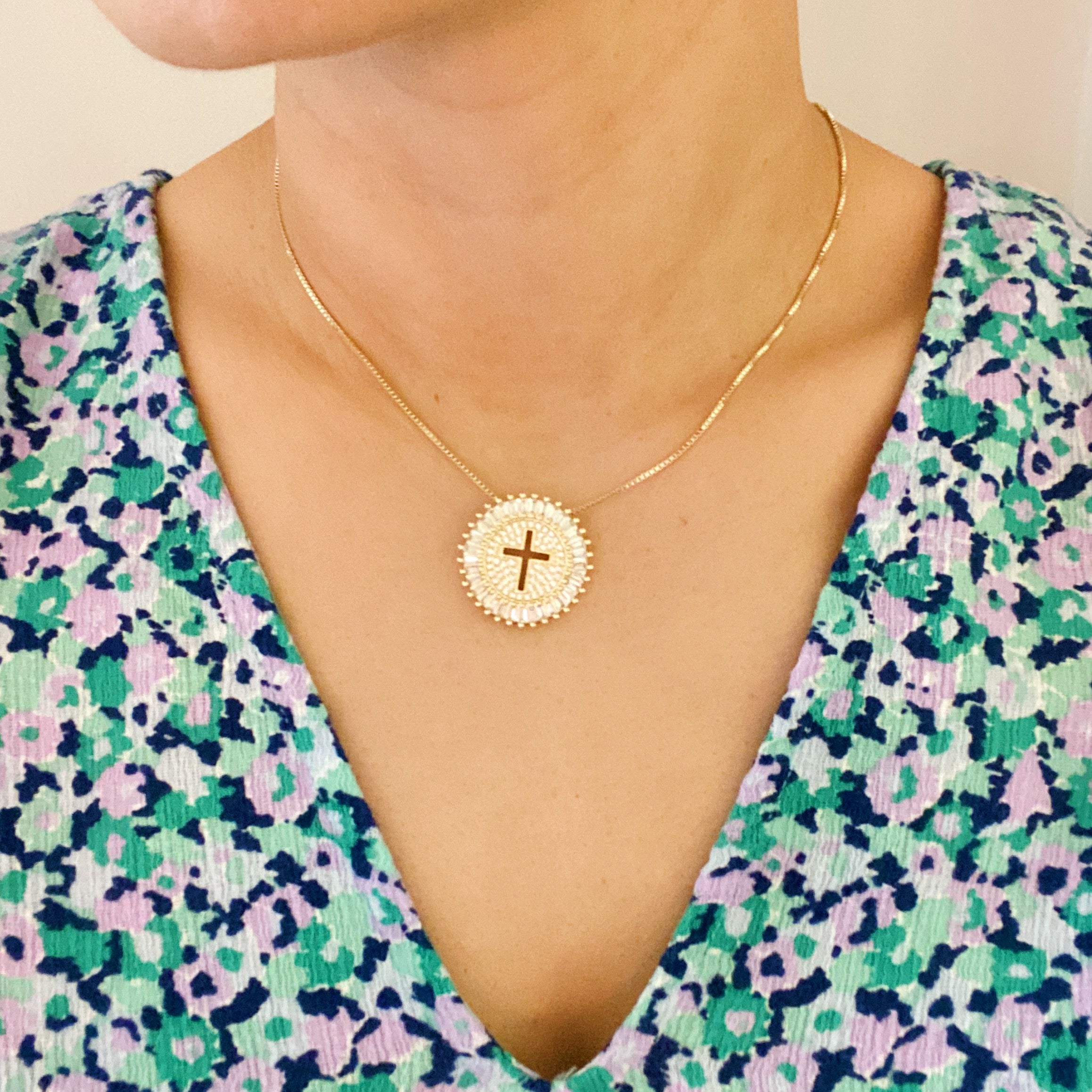 Shine Circle Cross Necklace featuring a sparkly round charm with a cut-out cross design, plated brass, and cubic zirconia.