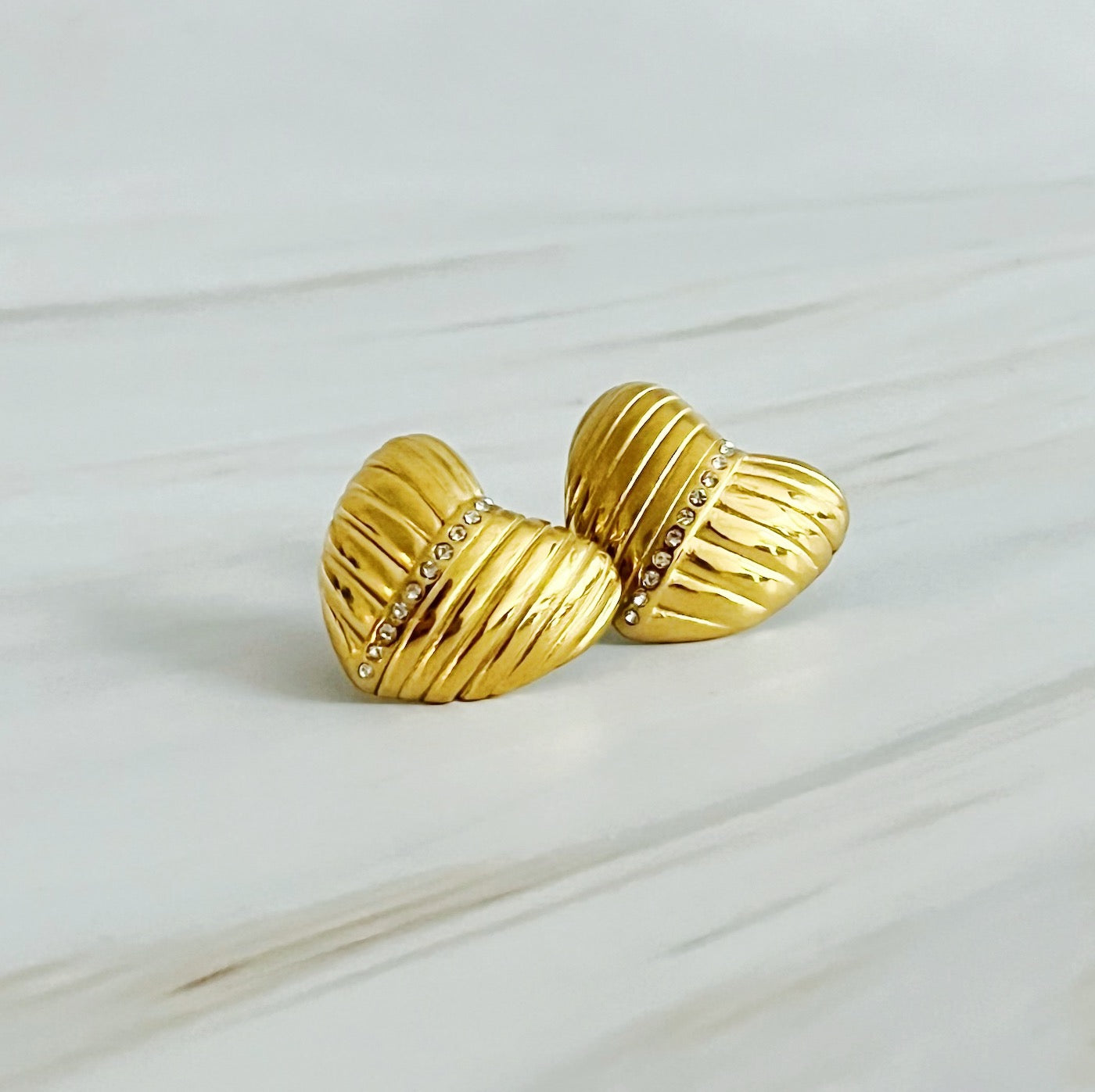 Shine Connects Us Heart Earrings featuring a textured design in 18k gold plated stainless steel, showcasing elegance and shine.