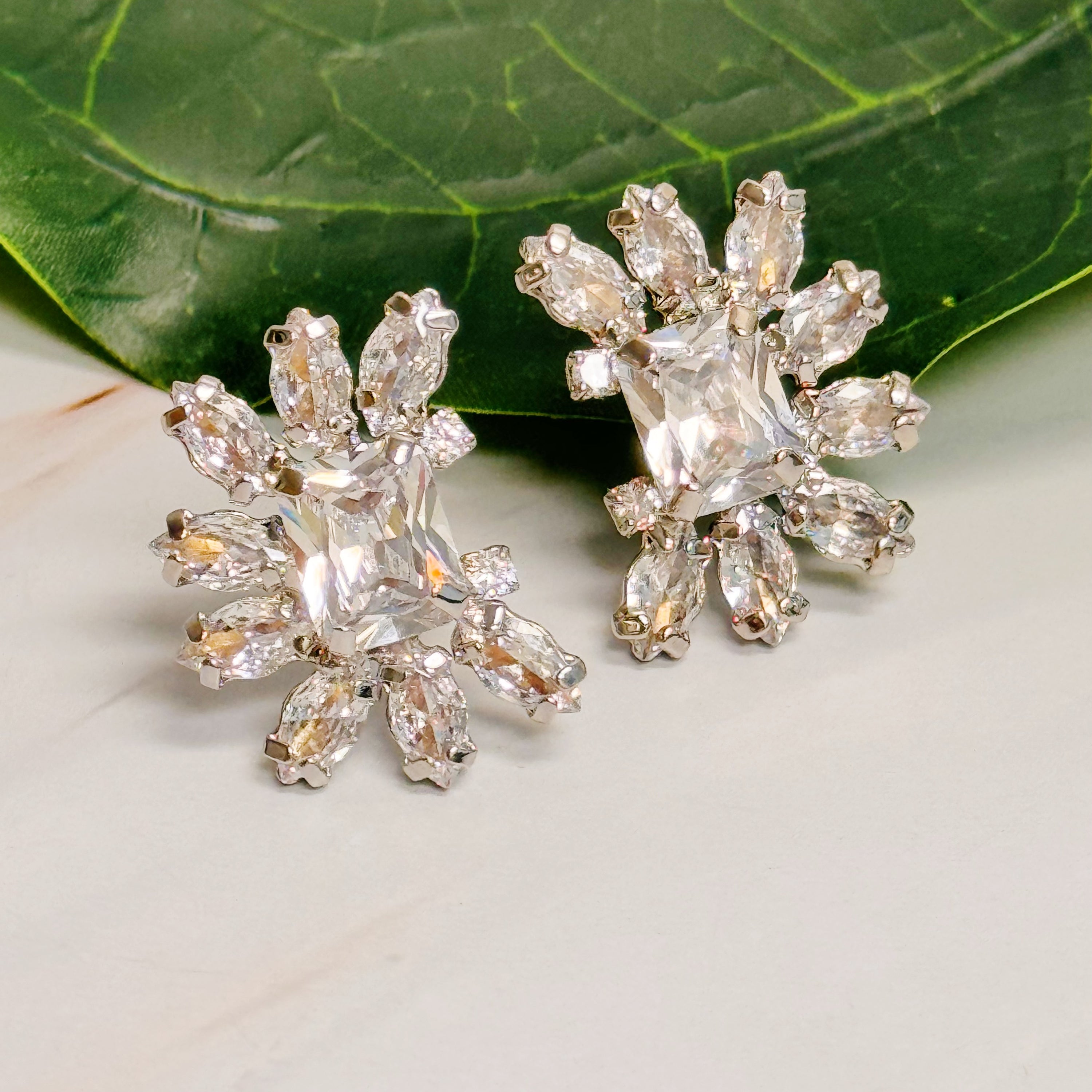 Shine Crusted Jewel Stud Earrings featuring sparkling glass stones on rhodium plated brass, elegantly designed for versatile styling.