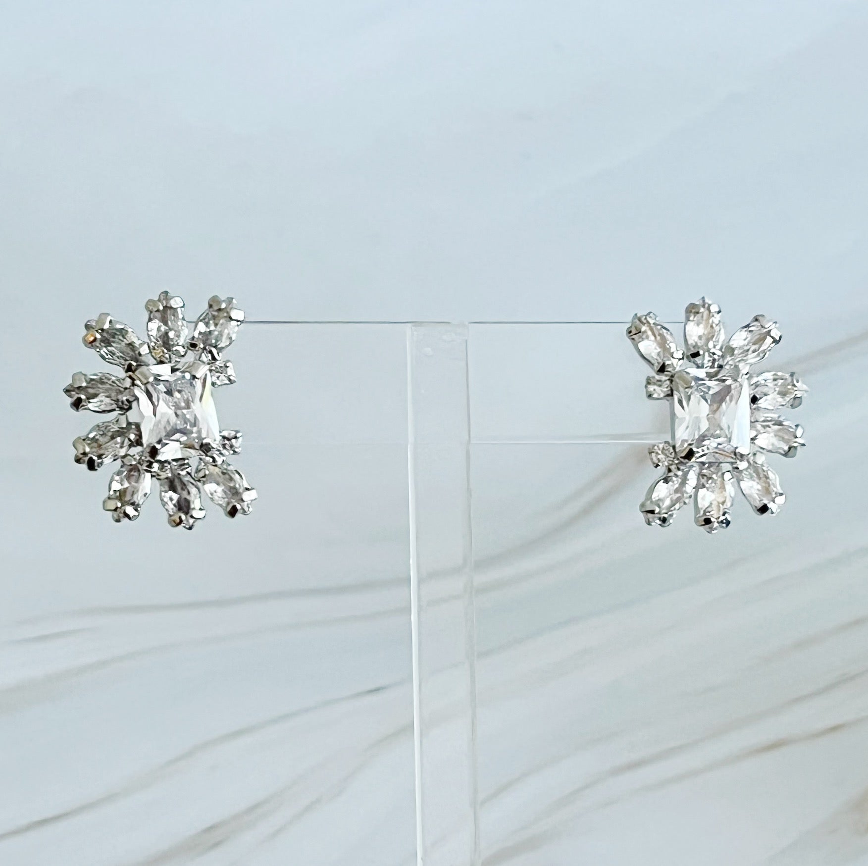 Shine Crusted Jewel Stud Earrings featuring sparkling glass stones on rhodium plated brass, elegantly designed for versatile styling.