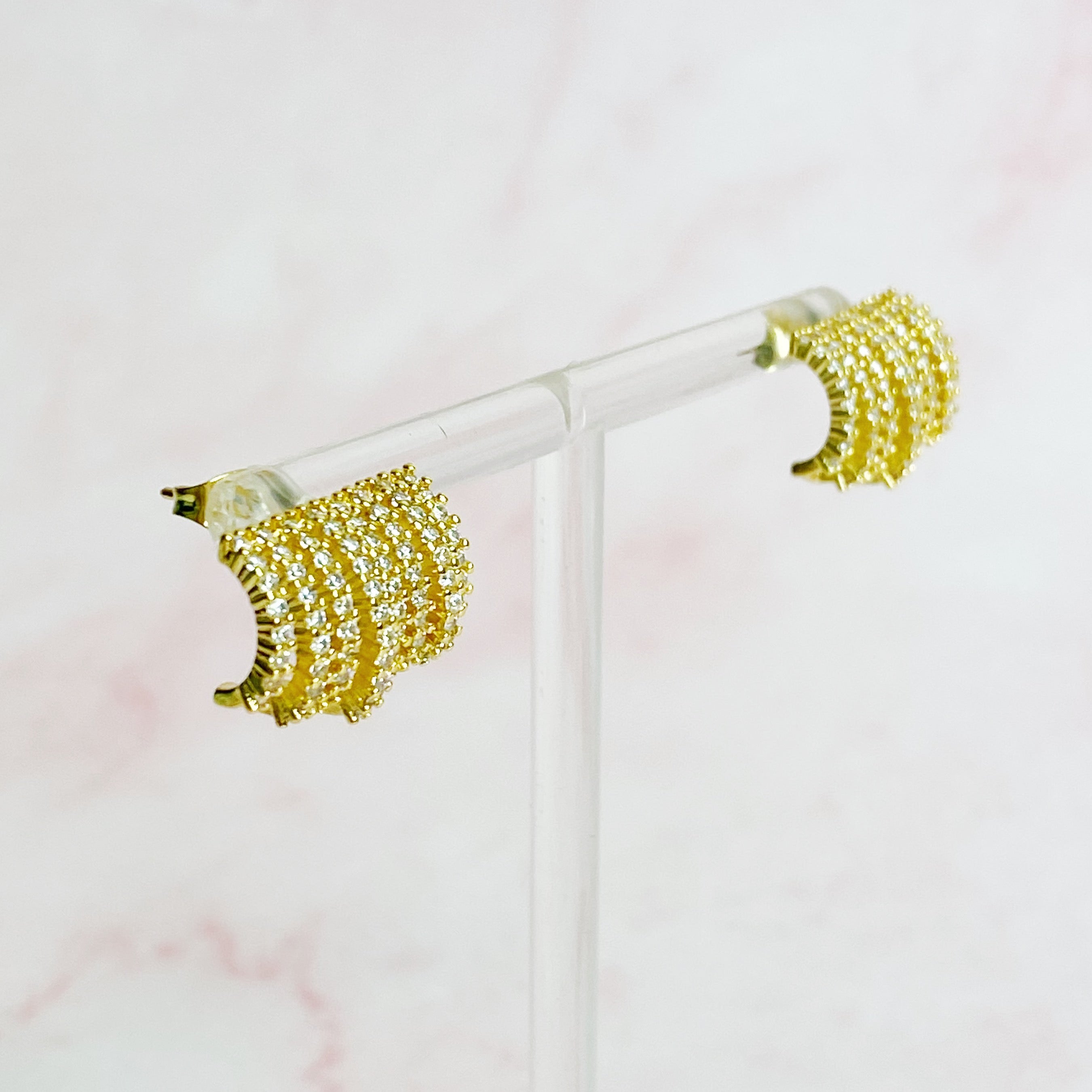 Elegant Shines In A Row Half Hoop Earrings featuring 18K gold or rhodium plating and sparkling cubic zirconia.