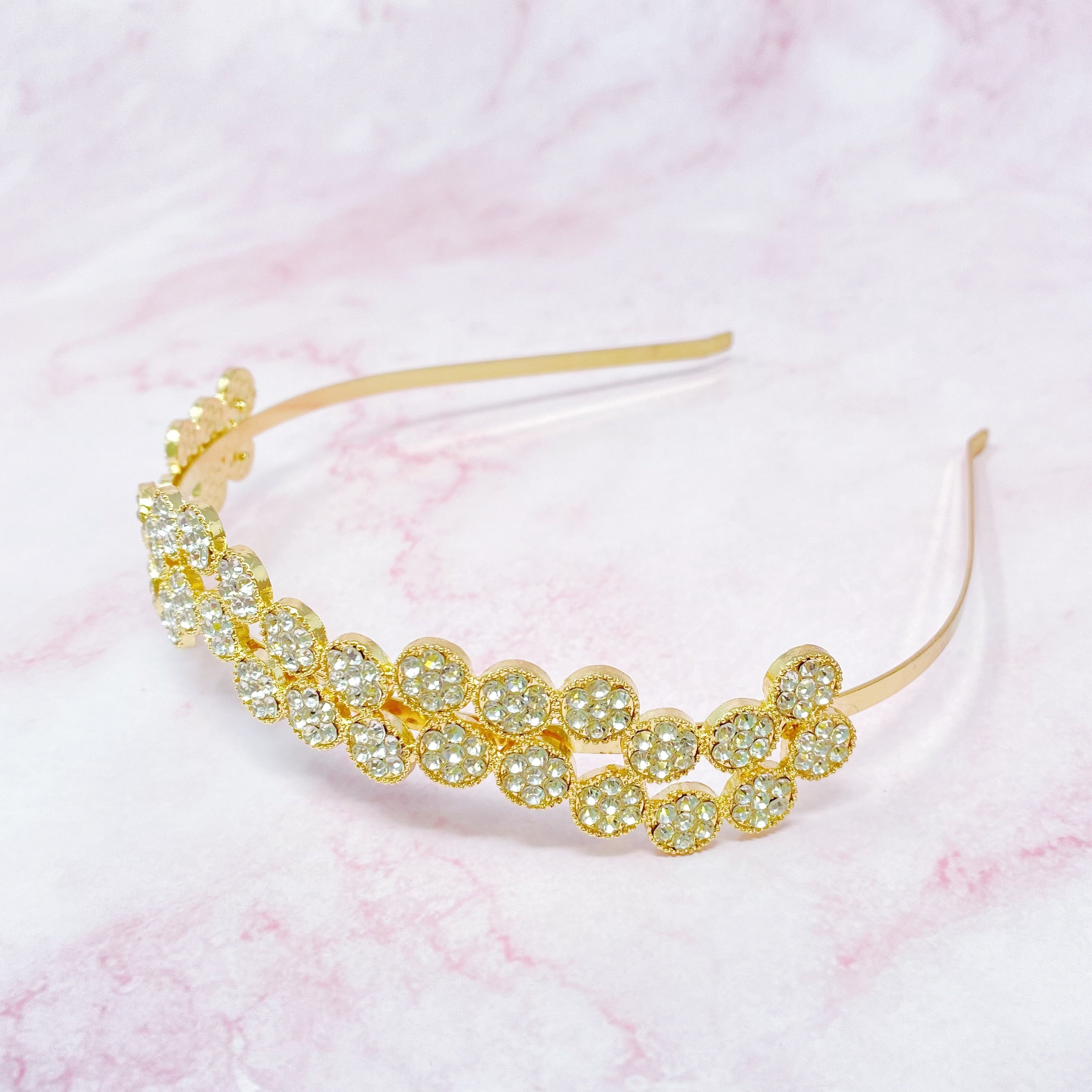 Shines In Circles Headband featuring sparkly circles in a wavy design, perfect for enhancing outfits.