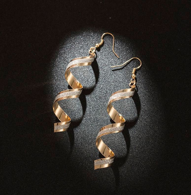 A pair of elegant Shining Frosted Spiral Earrings made from alloy, showcasing a unique spiral design with a frosted finish.