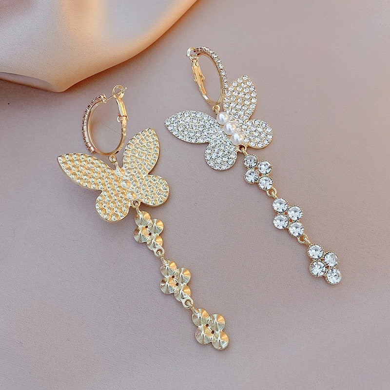 Elegant shiny big butterfly earrings with rhinestone tassels, showcasing intricate design and sparkling details.