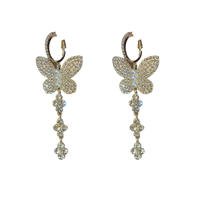 Elegant shiny big butterfly earrings with rhinestone tassels, showcasing intricate design and sparkling details.