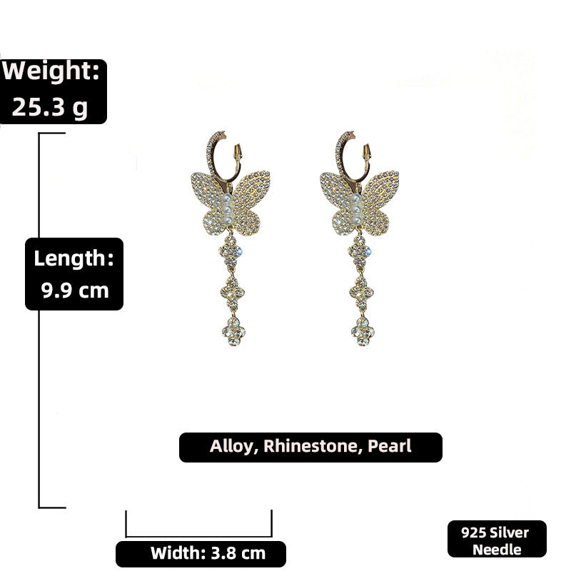 Elegant shiny big butterfly earrings with rhinestone tassels, showcasing intricate design and sparkling details.