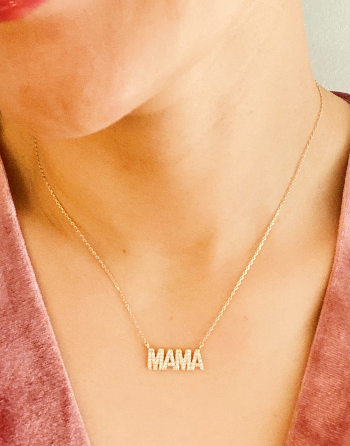 Shiny Mama Necklace featuring a clean font design with sparkling cubic zirconia stones on an 18k gold plated brass chain.