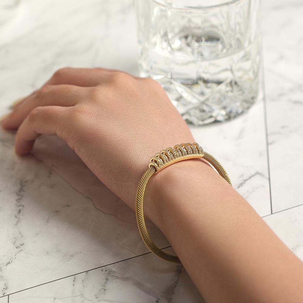 Shiny Parallel CZ Bangle made of surgical stainless steel with gold plating, featuring a sleek and modern design.