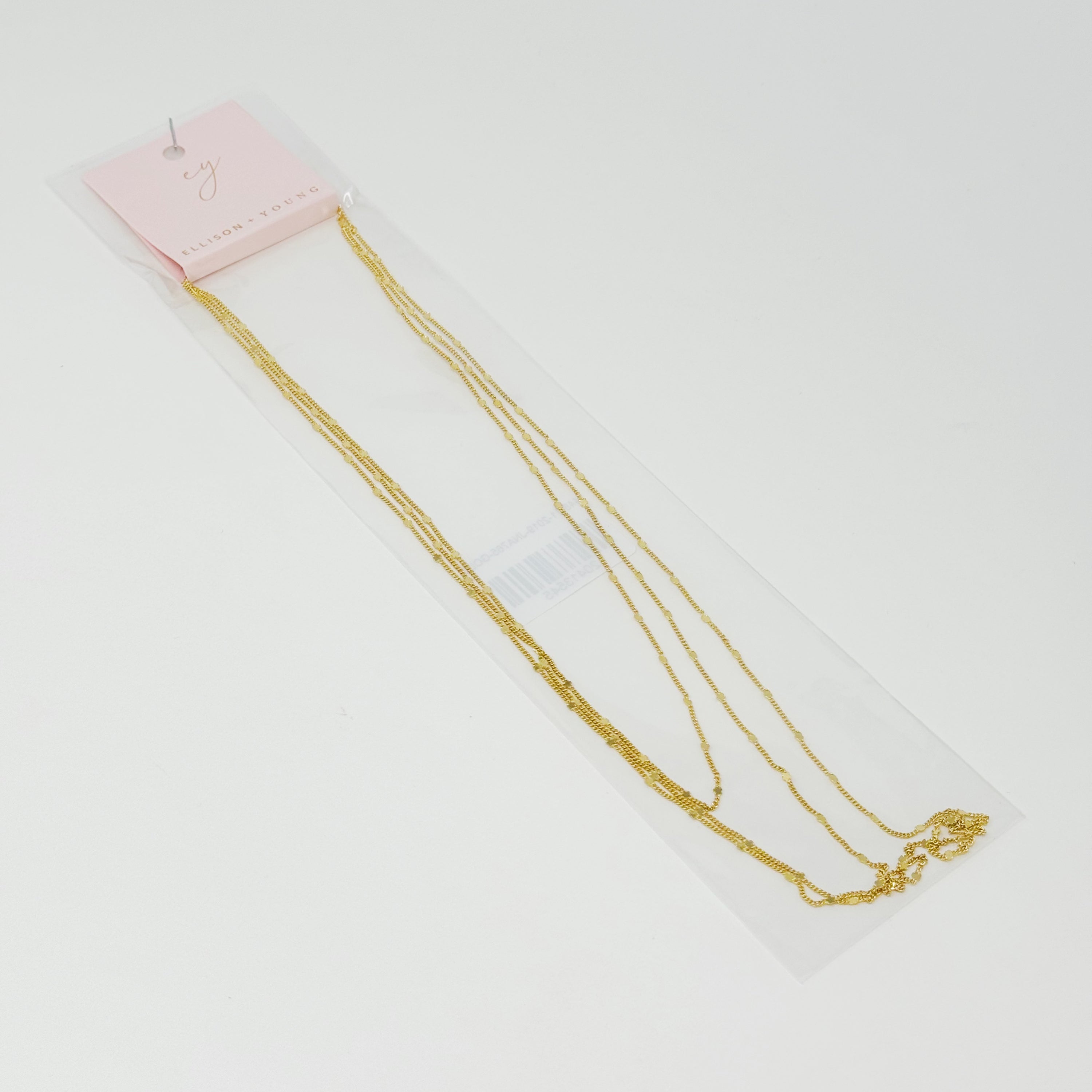 Show Me The Ways Necklace in Gold featuring tiny stars on a long linked chain, showcasing its elegant design and versatility.