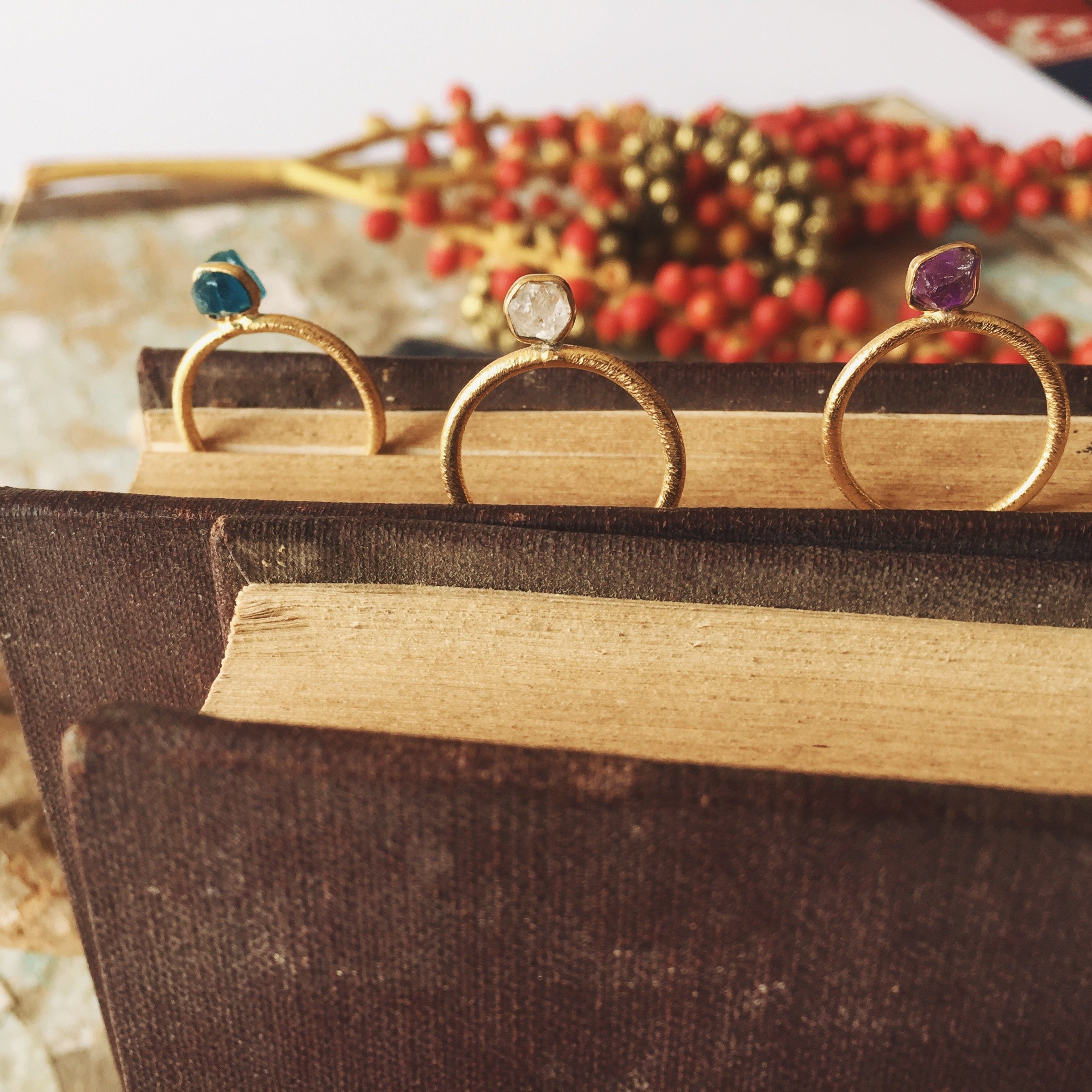 Sienna Raw Stone Ring featuring adjustable 18K gold plating and unique raw stones, showcasing its handmade craftsmanship.