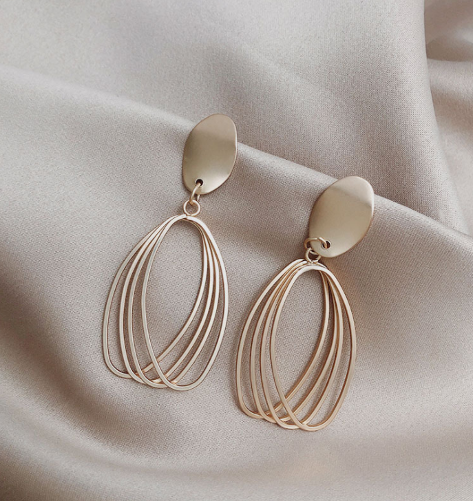 Elegant Silk Collection Earrings featuring geometric designs and 925 silver needles, perfect for any occasion.