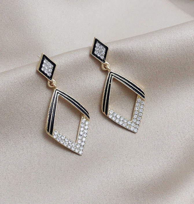 Elegant Silk Collection Earrings featuring geometric designs and 925 silver needles, perfect for any occasion.