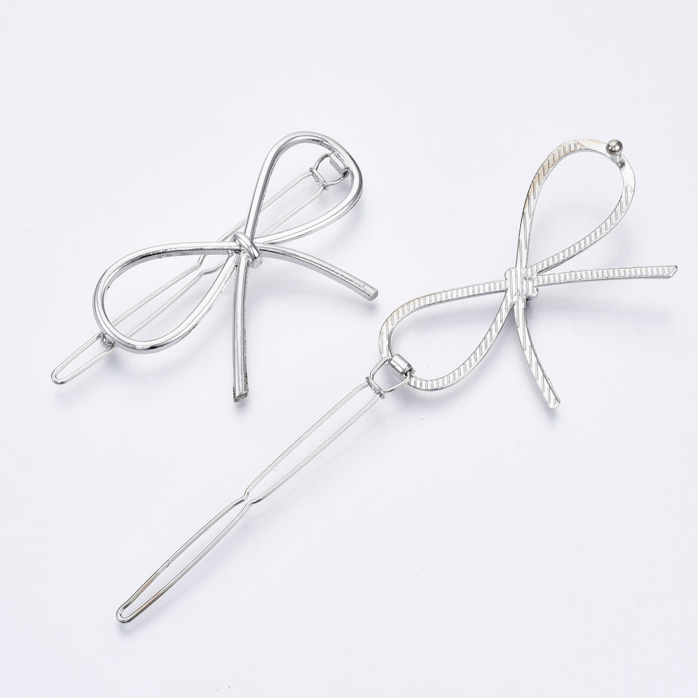 Silver Bow Hair Slide made from metal alloy, elegantly designed with a shiny finish, perfect for securing hairstyles.