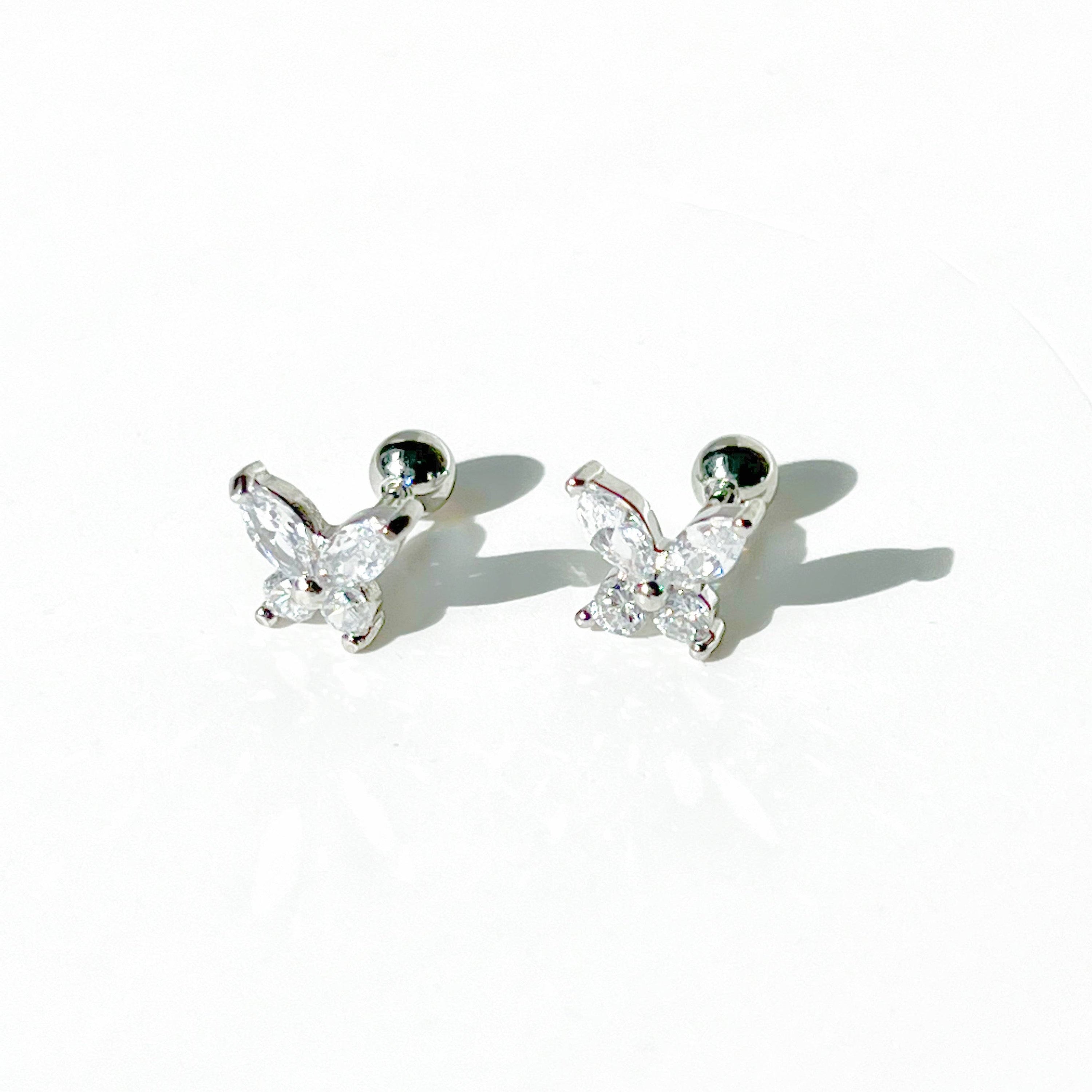 A pair of elegant silver butterfly earrings adorned with clear zircon, showcasing a delicate design.