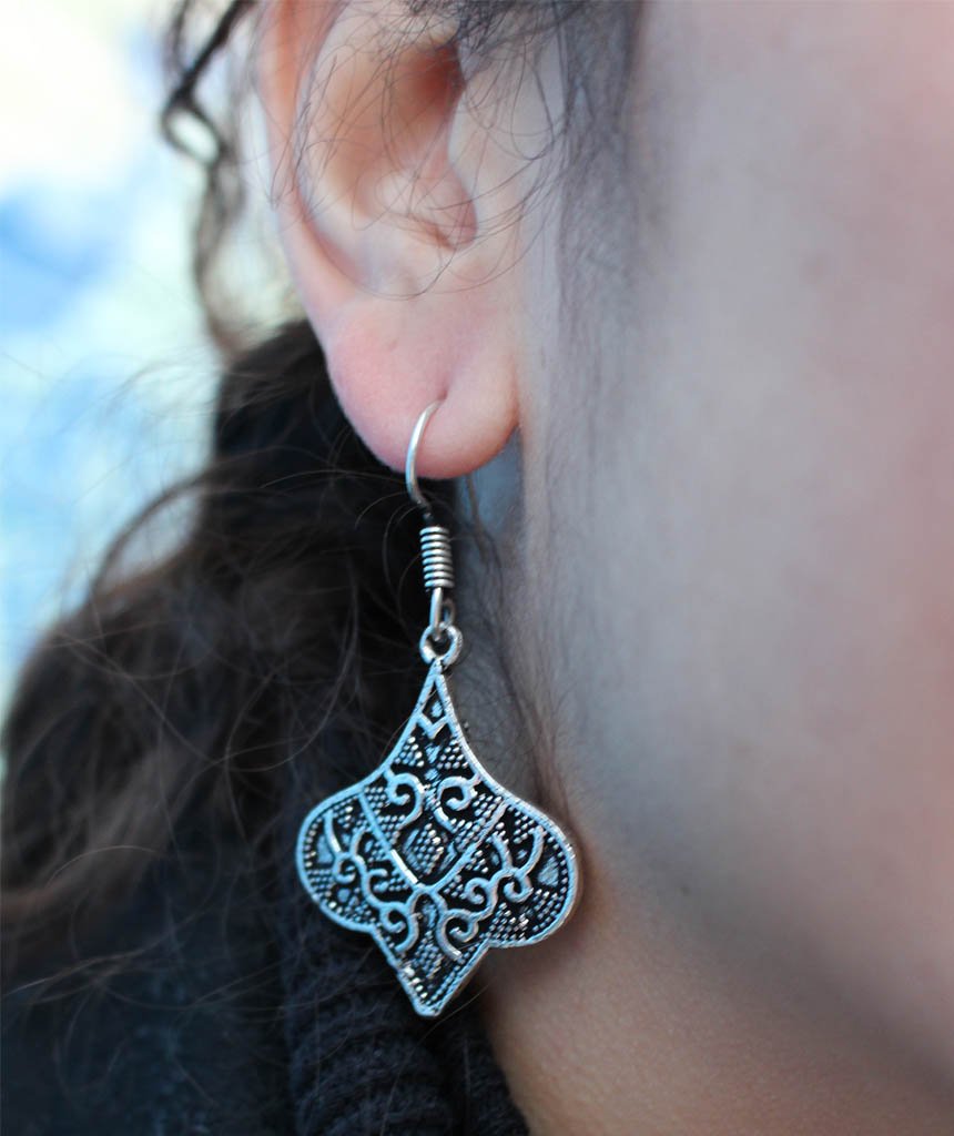 A pair of stunning silver ethnic earrings featuring intricate designs, perfect for festivals and everyday wear, made from hypoallergenic materials.