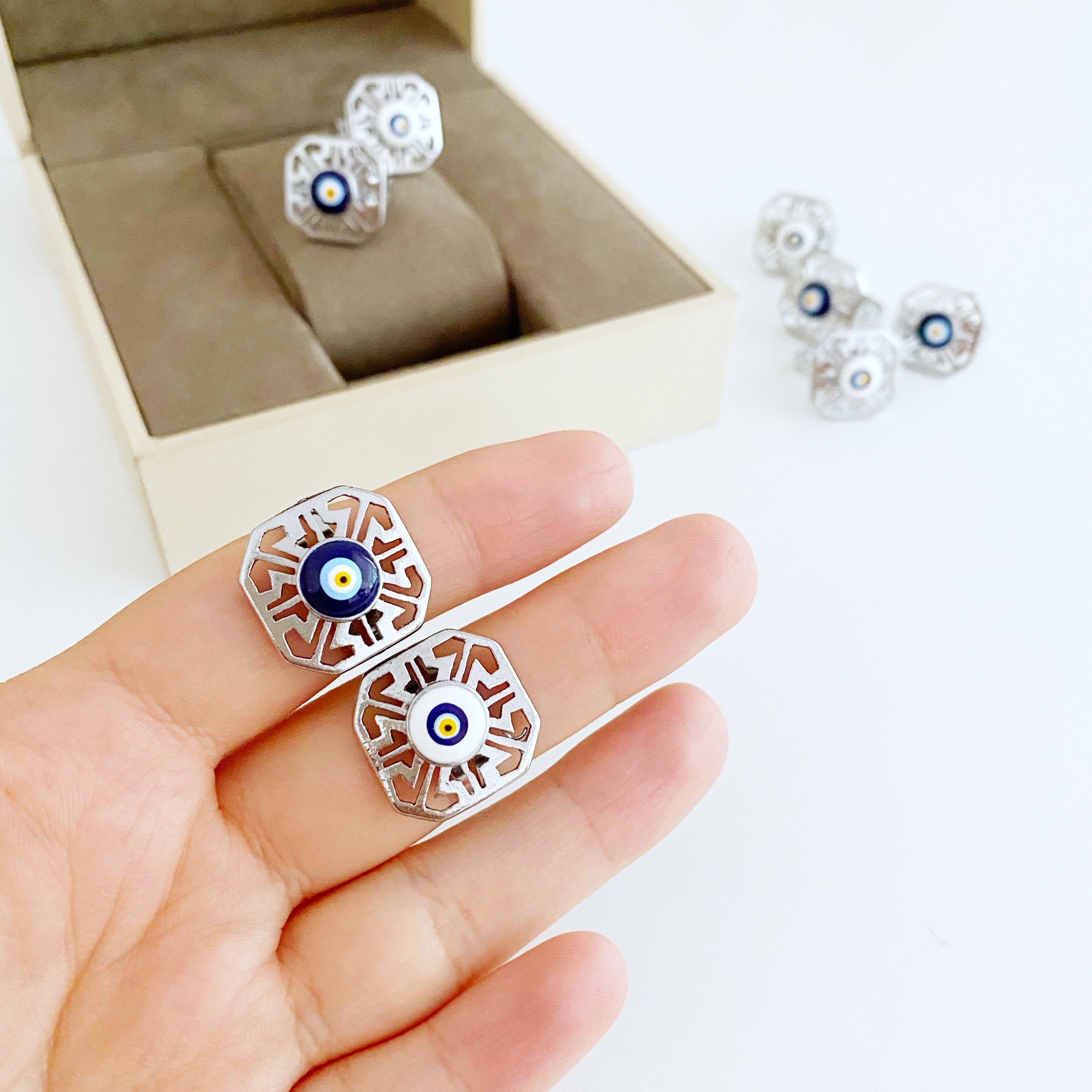 A beautiful silver adjustable evil eye ring featuring blue and white beads, symbolizing protection and style.