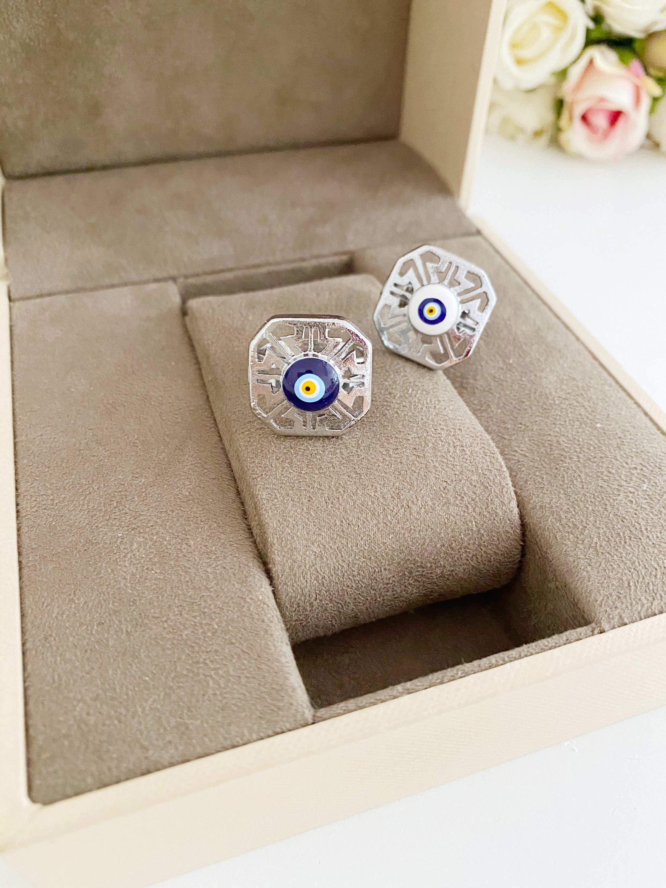 A beautiful silver adjustable evil eye ring featuring blue and white beads, symbolizing protection and style.