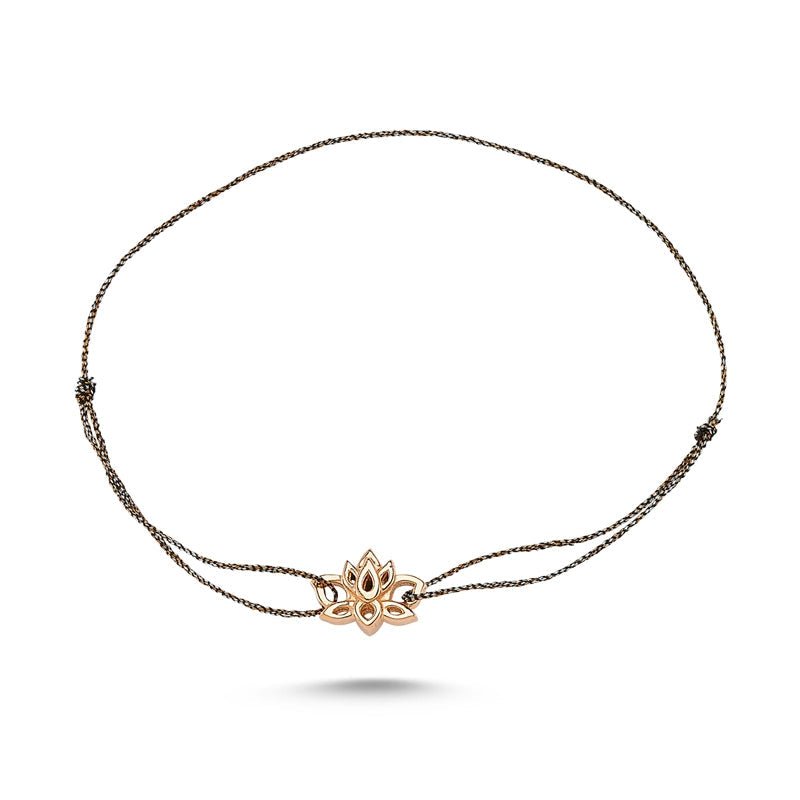 A delicate Silver Lotus Flower String Bracelet made of 925 sterling silver with a lotus flower charm, showcasing its elegant design.