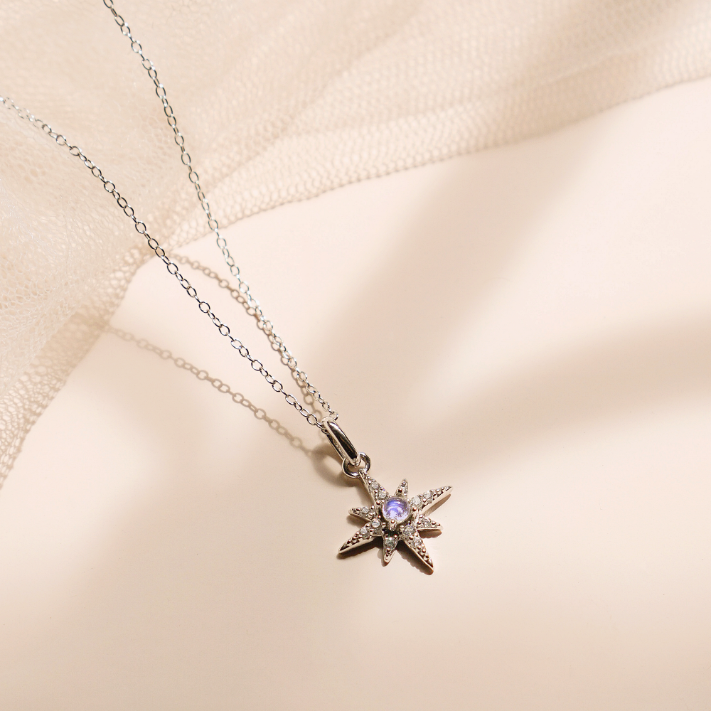 A beautiful Silver North Star Necklace featuring a 15mm pendant on an adjustable chain, symbolizing hope and guidance.