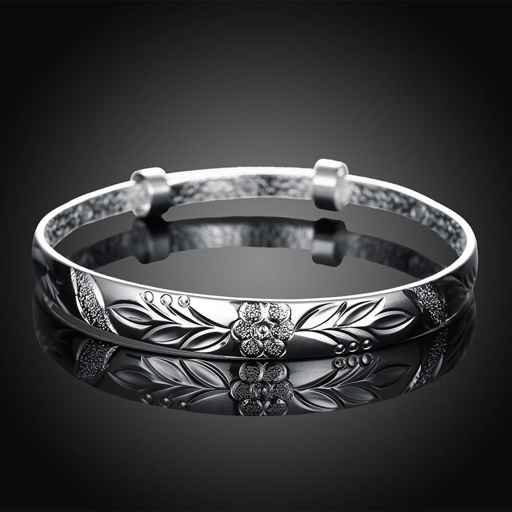 Silver plated adjustable bangle featuring a botanical gardens floral design, suitable for all wrist sizes.