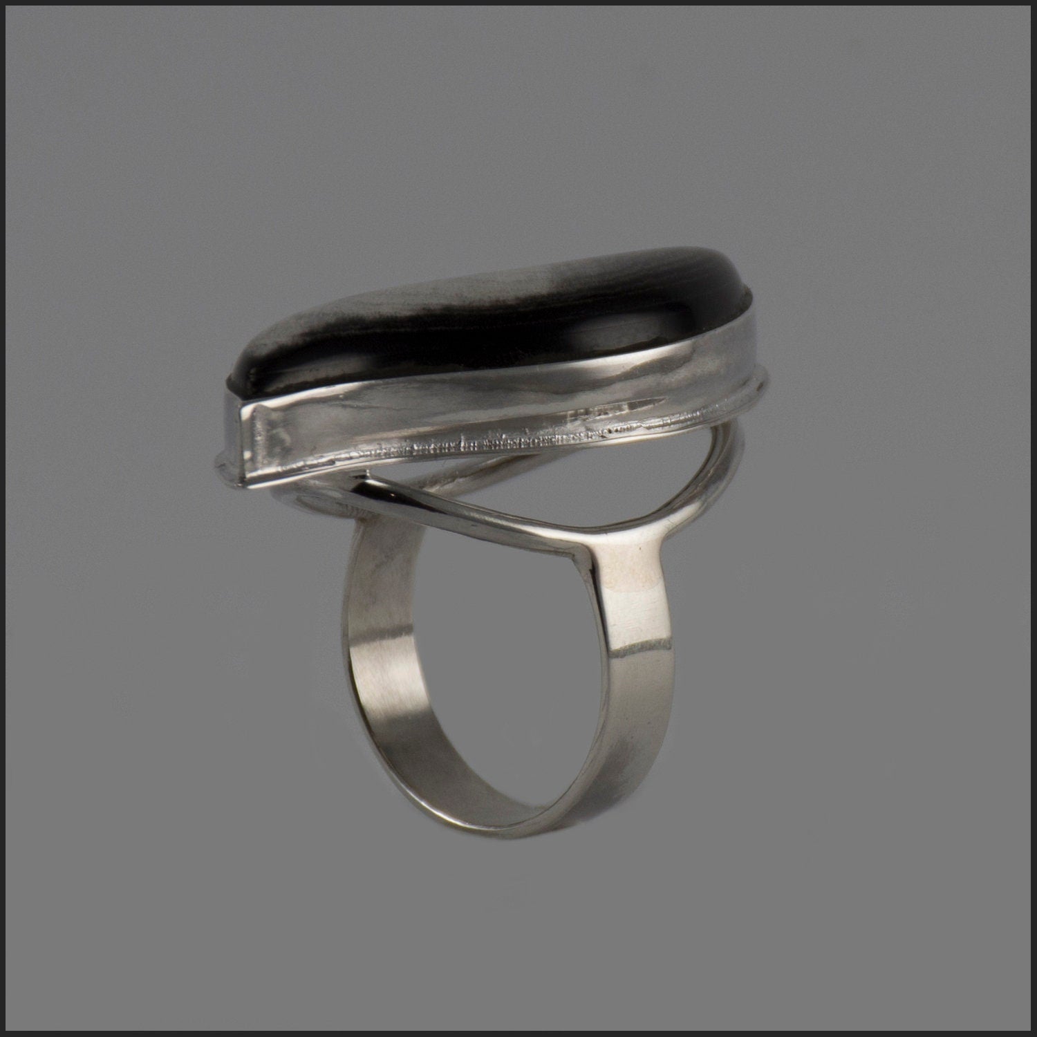 Handmade silver ring featuring a polished natural horn cabochon, showcasing a unique boho design.