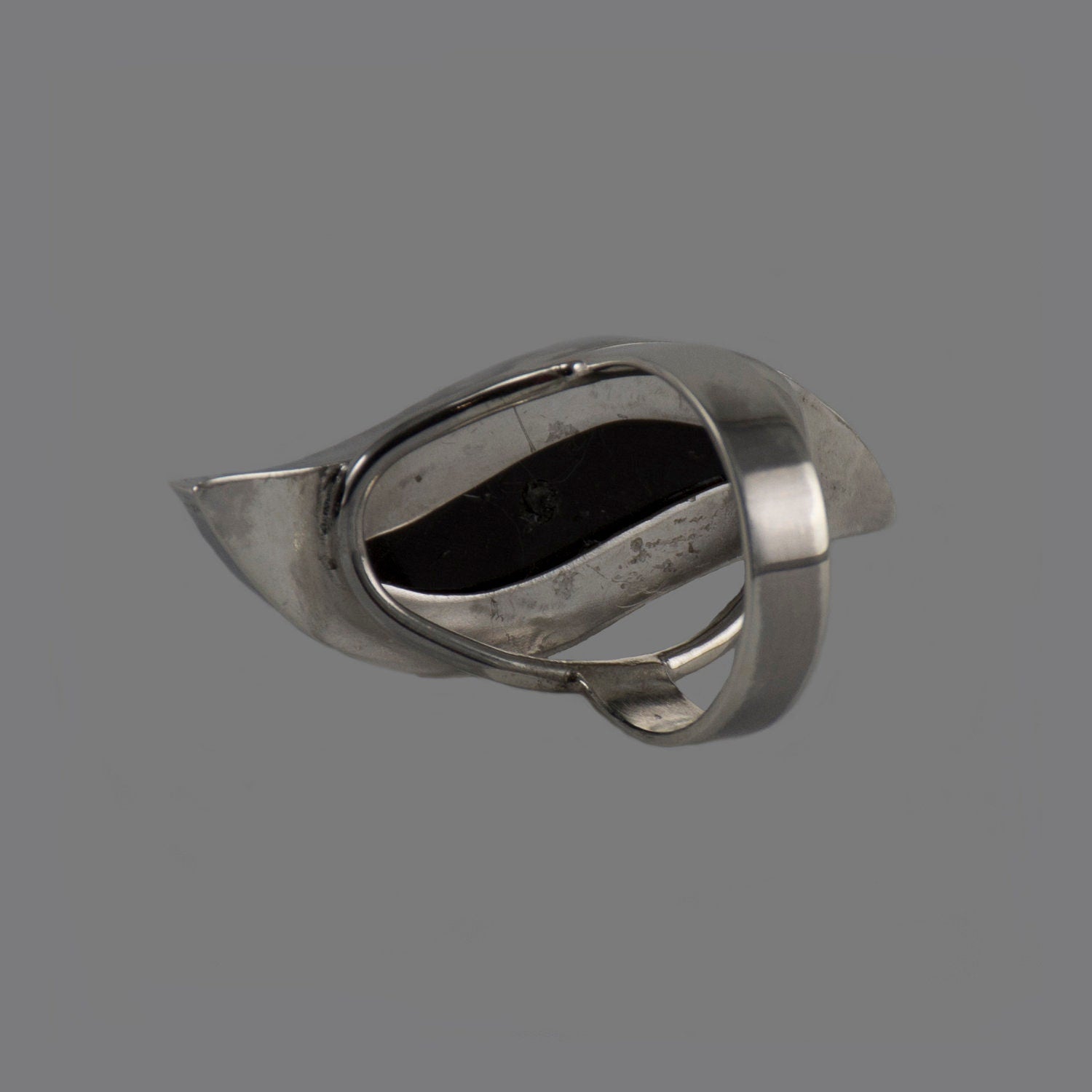 Handmade silver ring featuring a polished natural horn cabochon, showcasing a unique boho design.