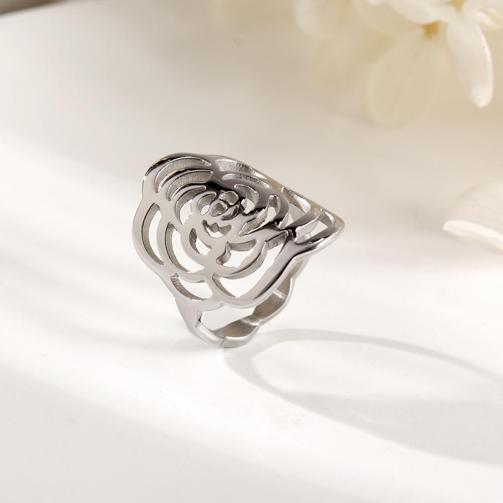 A stunning silver rose ring featuring intricate openwork design, perfect for elegant occasions and everyday wear.