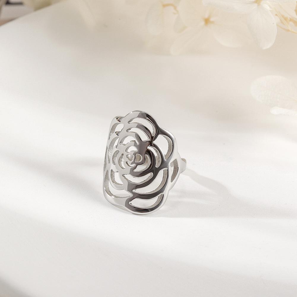 A stunning silver rose ring featuring intricate openwork design, perfect for elegant occasions and everyday wear.