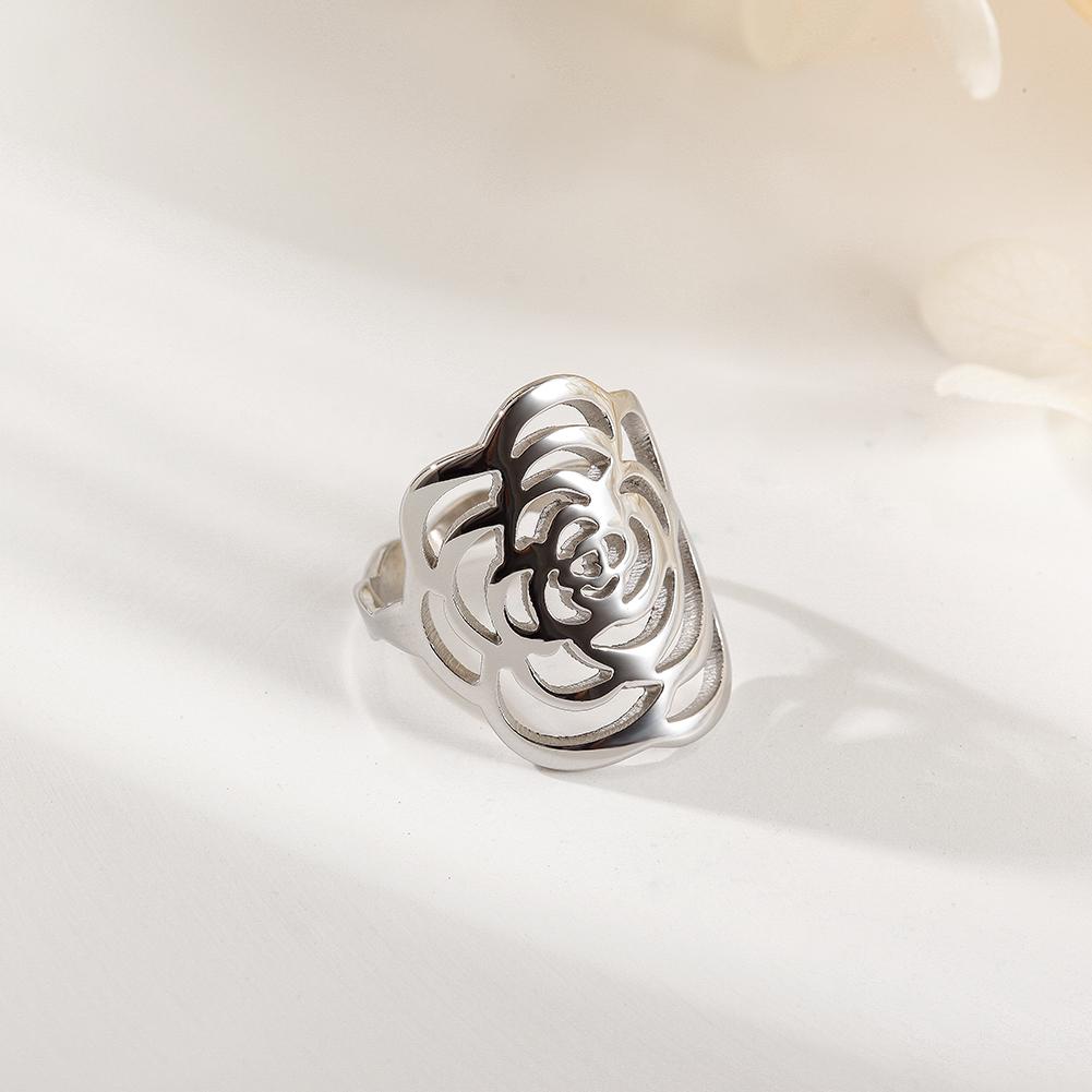 A stunning silver rose ring featuring intricate openwork design, perfect for elegant occasions and everyday wear.