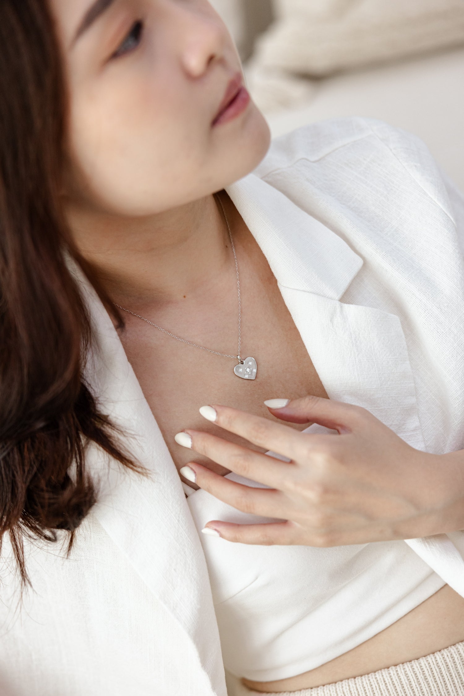 A stunning silver heart-shaped pendant adorned with delicate stars, symbolizing love and individuality.