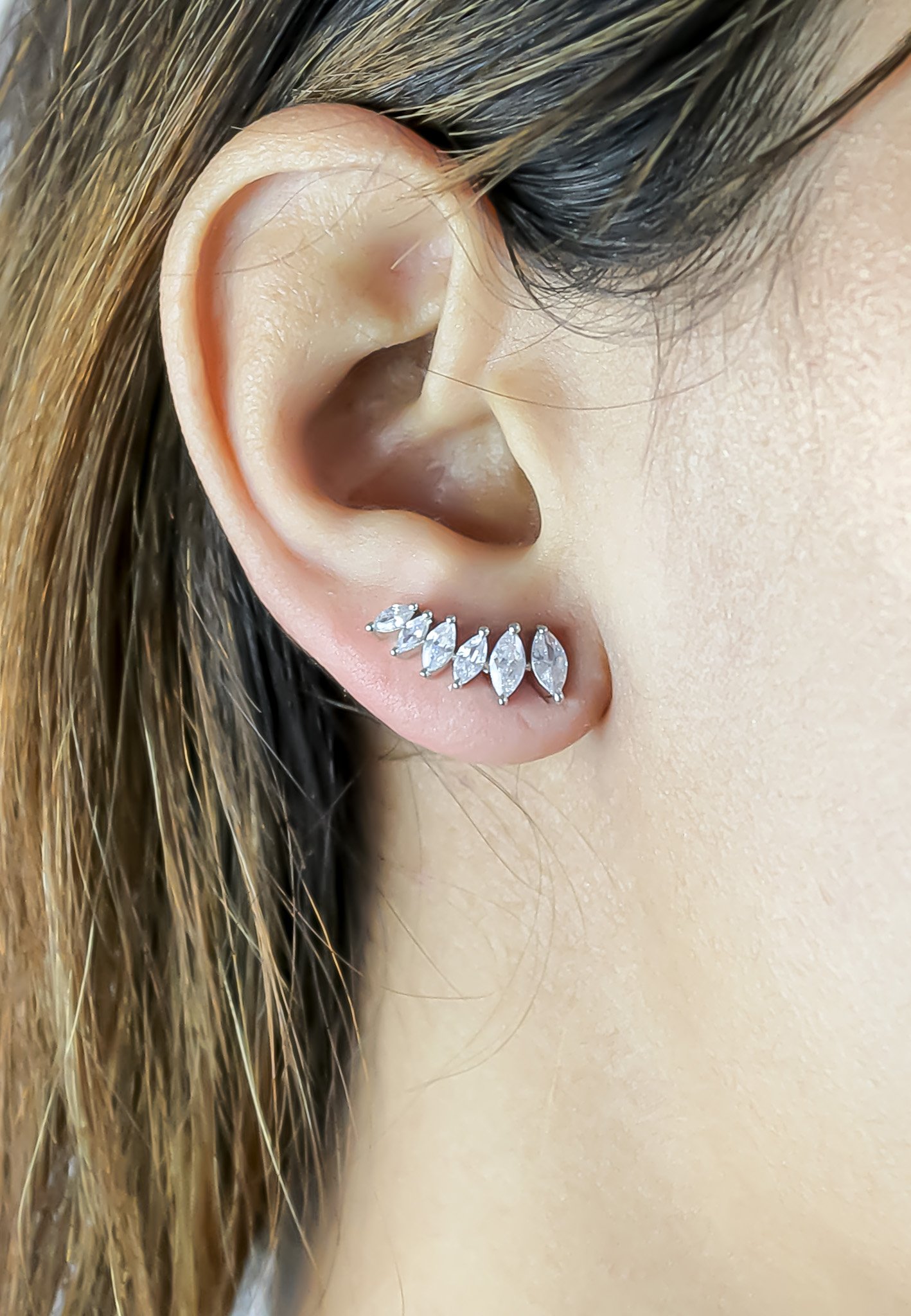 A pair of elegant silver-plated stepping earrings designed for pierced ears, featuring a modern and lightweight design.