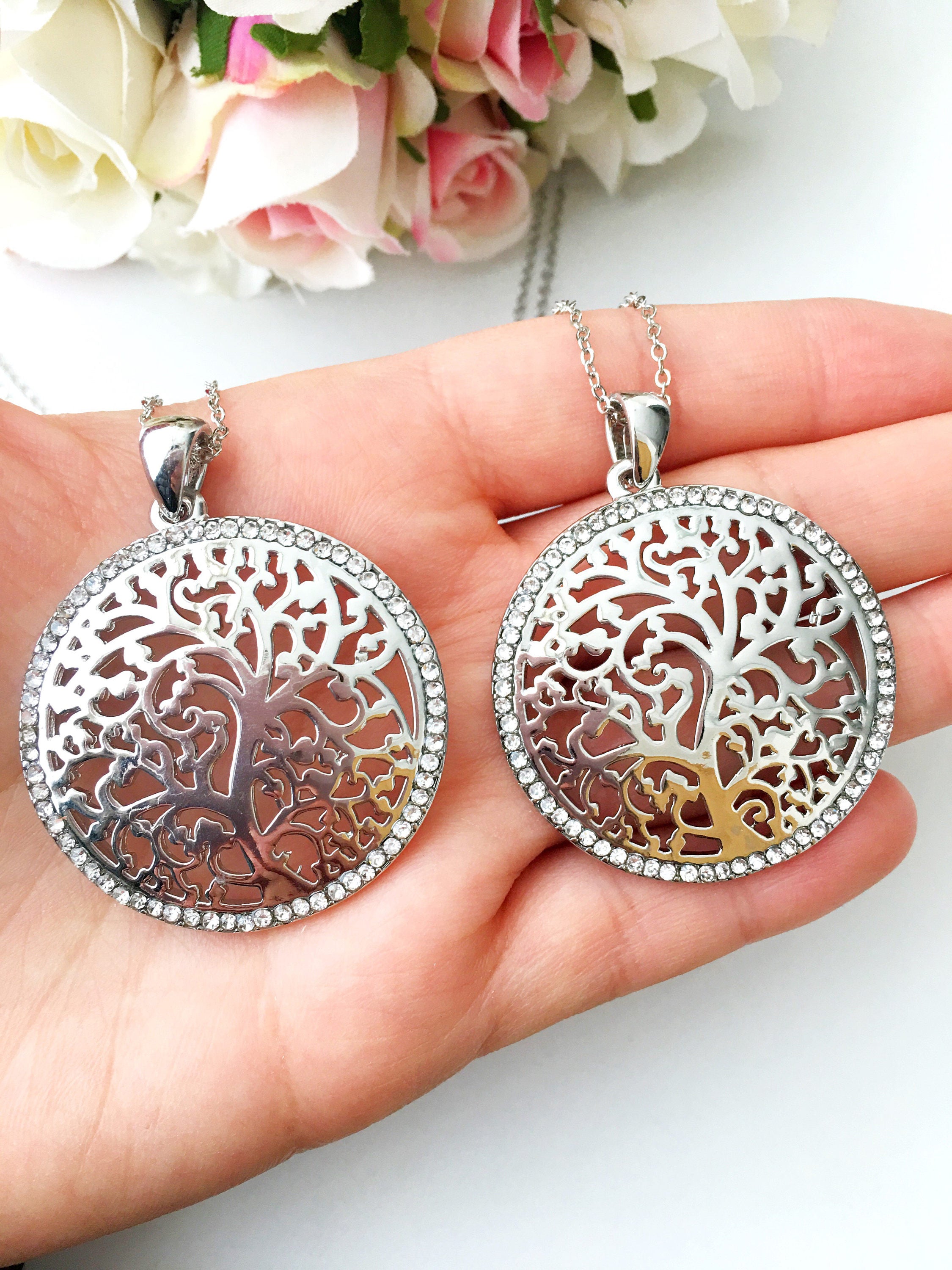 Silver Tree of Life Necklace featuring a detailed charm on a long stainless steel chain, symbolizing family and connection.